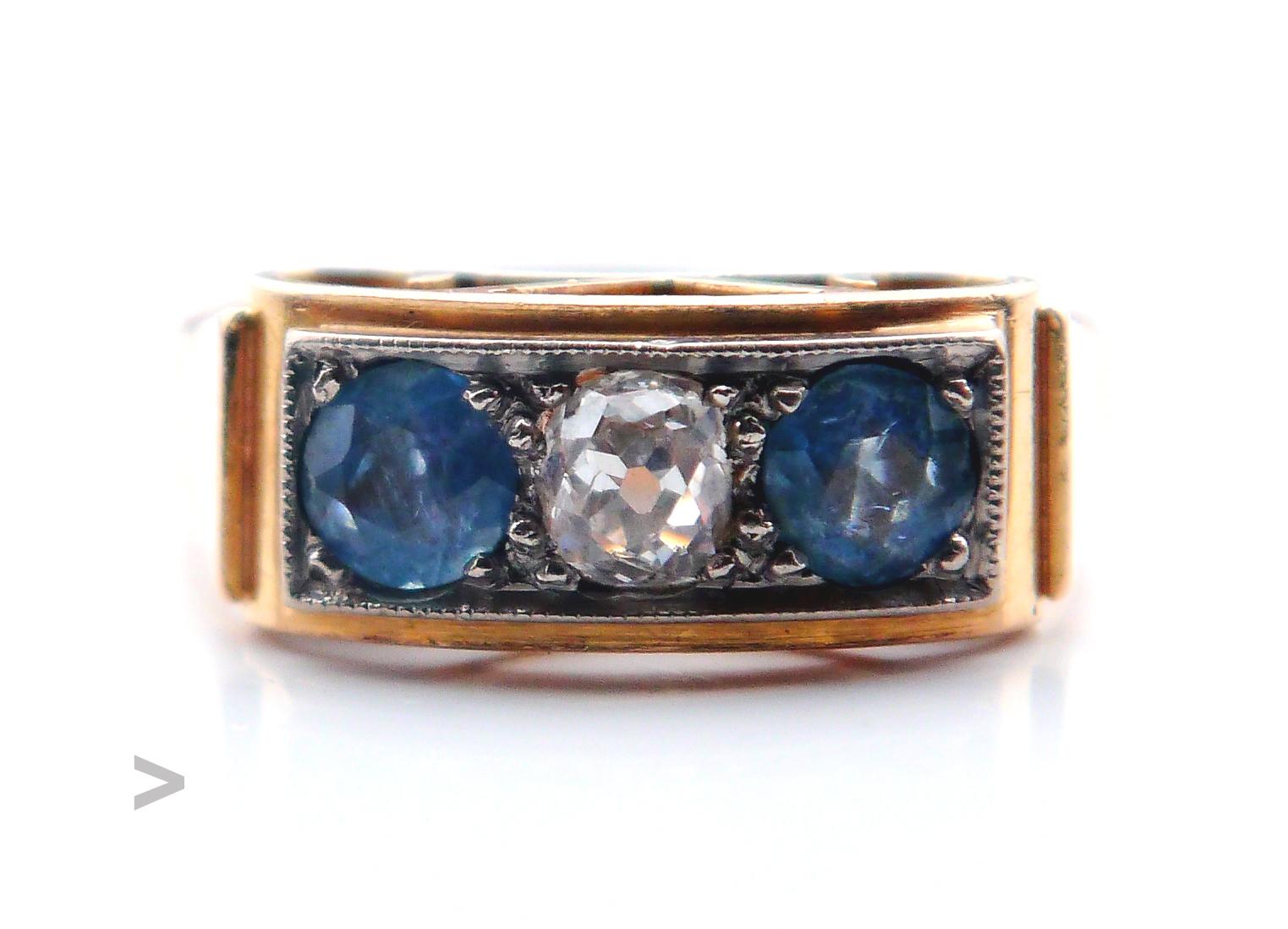 Antique Three - Stone Ring featuring solid 18K Yellow and White Gold frame holding 3 gem stones, period :  ca.1920s -1940s. Hallmarked 18K.

Crown's is 13.5 mm long x 6 mm deep. Old diamond cut Diamond Ø 4.25 mm X 4.25 mm deep /ca. 0.5 ct. color