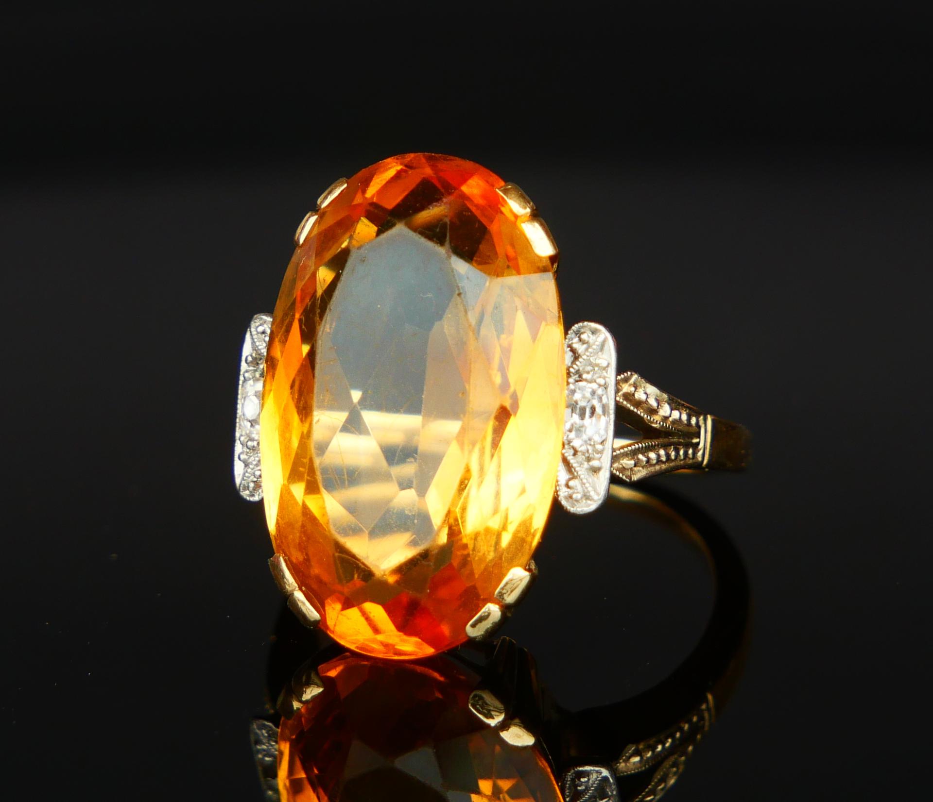 A Citrine Ring, band with divided shoulders and crown in solid 14ct Greenish Yellow Gold featuring claw set natural Yellow - Orange Citrine stone oval cut  21 mm  x 13 mm x 7.75 mm deep / ca. 12 ct. accented with two old mine cut Diamonds Ø 2.75 mm