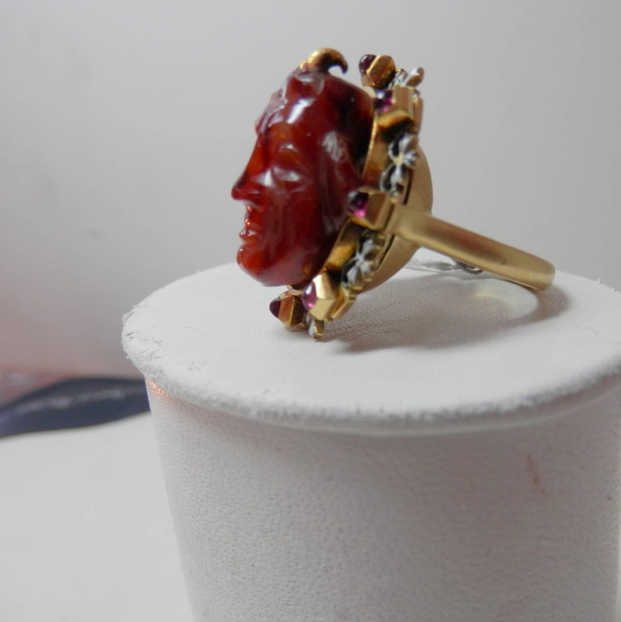 Holbeinesque Antique Ring of a Fine Carving Surrounded with Rubies and Enamel