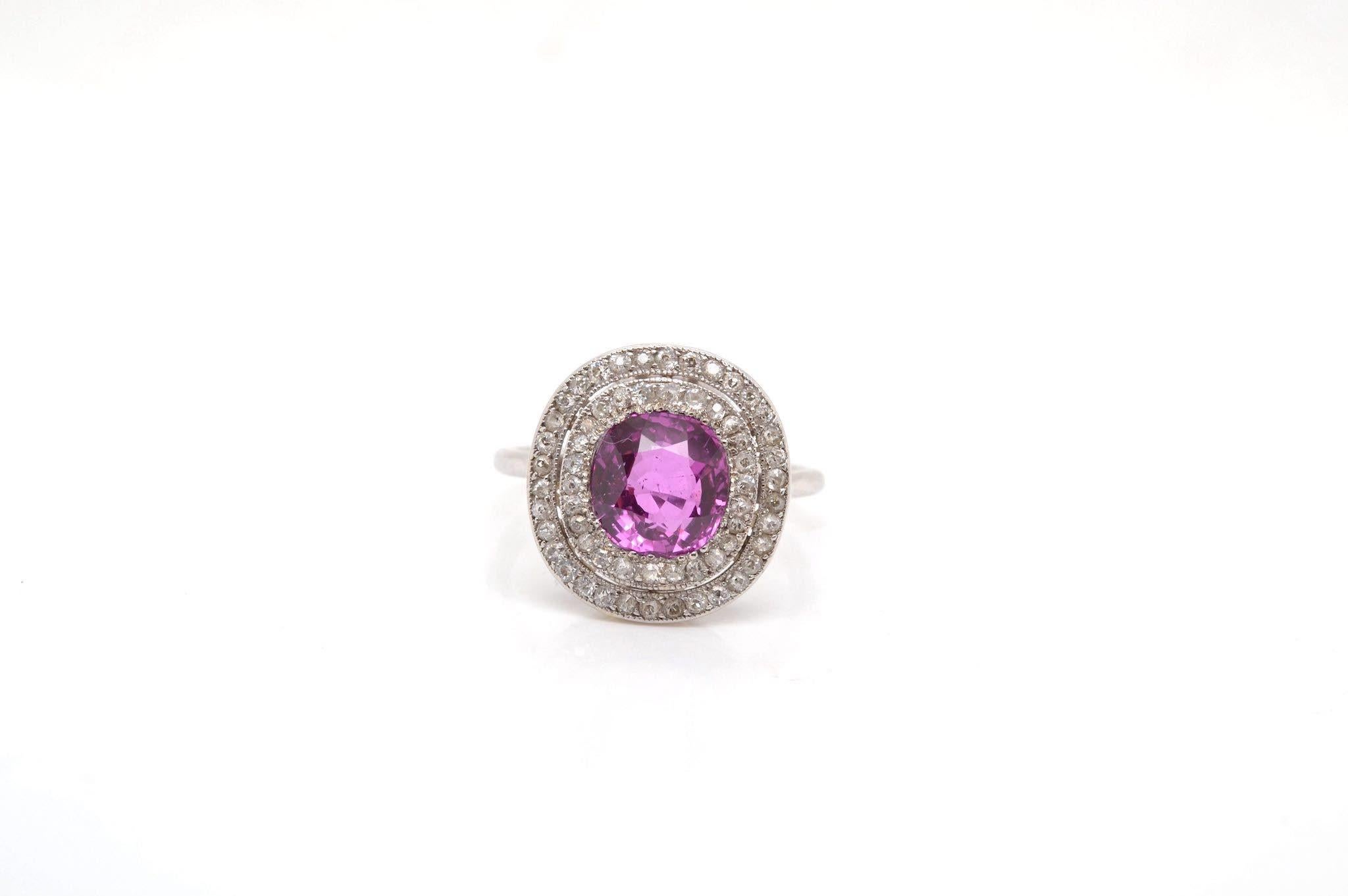 Stones: Ceylon pink sapphire, weight: 2.67cts and surrounding old cut diamonds, weight: 0.70ct
Material: Platinum
Dimensions: 1.7cm x 1.5cm
Weight: 5.8g
Size: 55 (free sizing)
Period: Early 20th
Certificate
Ref. : 24927