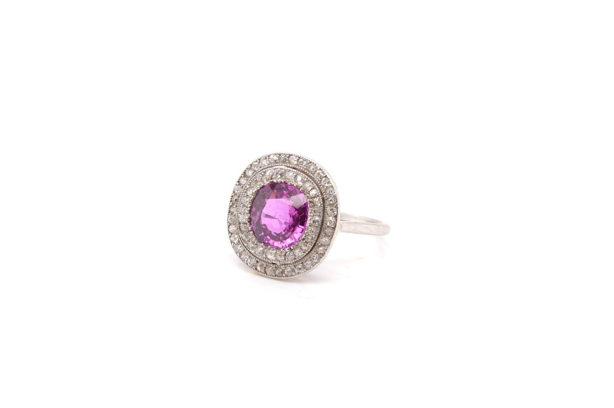 Ball Cut Antique ring set with a pink sapphire and diamonds For Sale