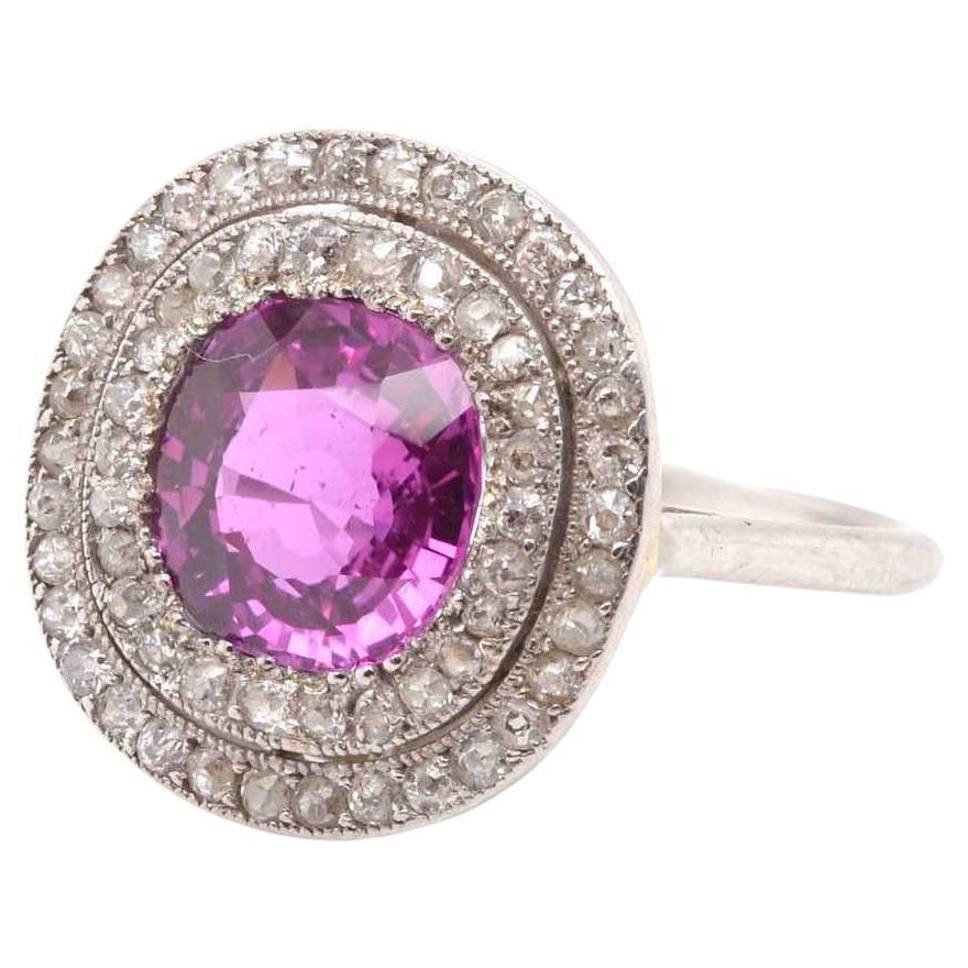 Antique ring set with a pink sapphire and diamonds For Sale