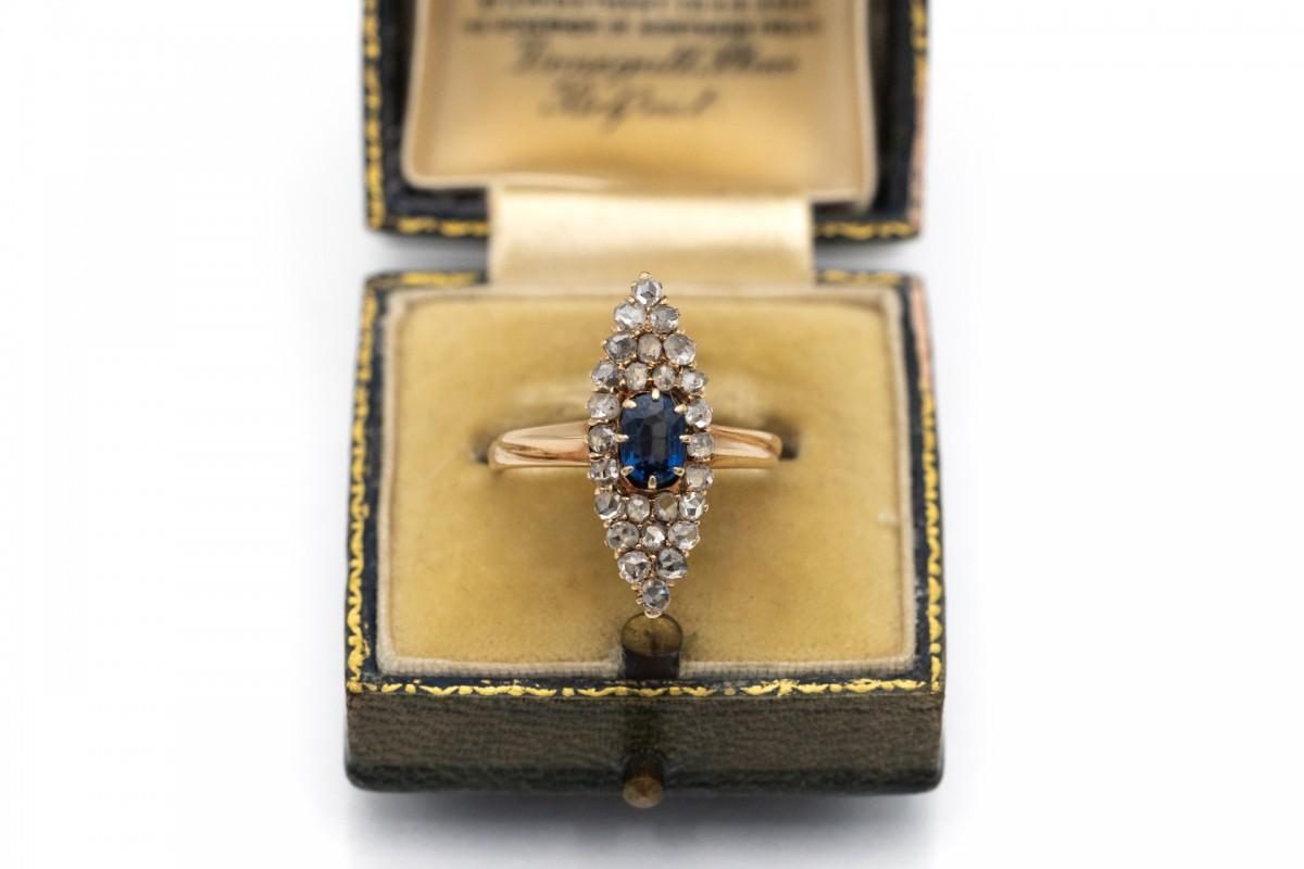 Marquise Cut Antique ring with sapphire and diamonds in the shape of a marquise.