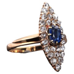 Antique ring with sapphire and diamonds in the shape of a marquise.