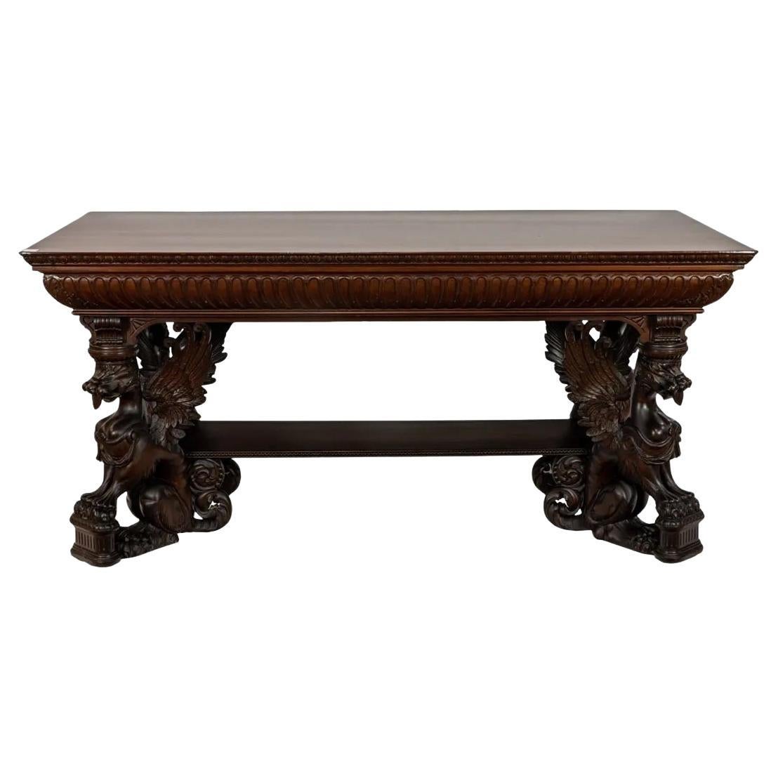 Antiquities R.J. Table de bibliothèque Horner en acajou sculpté avec supports de griffon ailé en vente