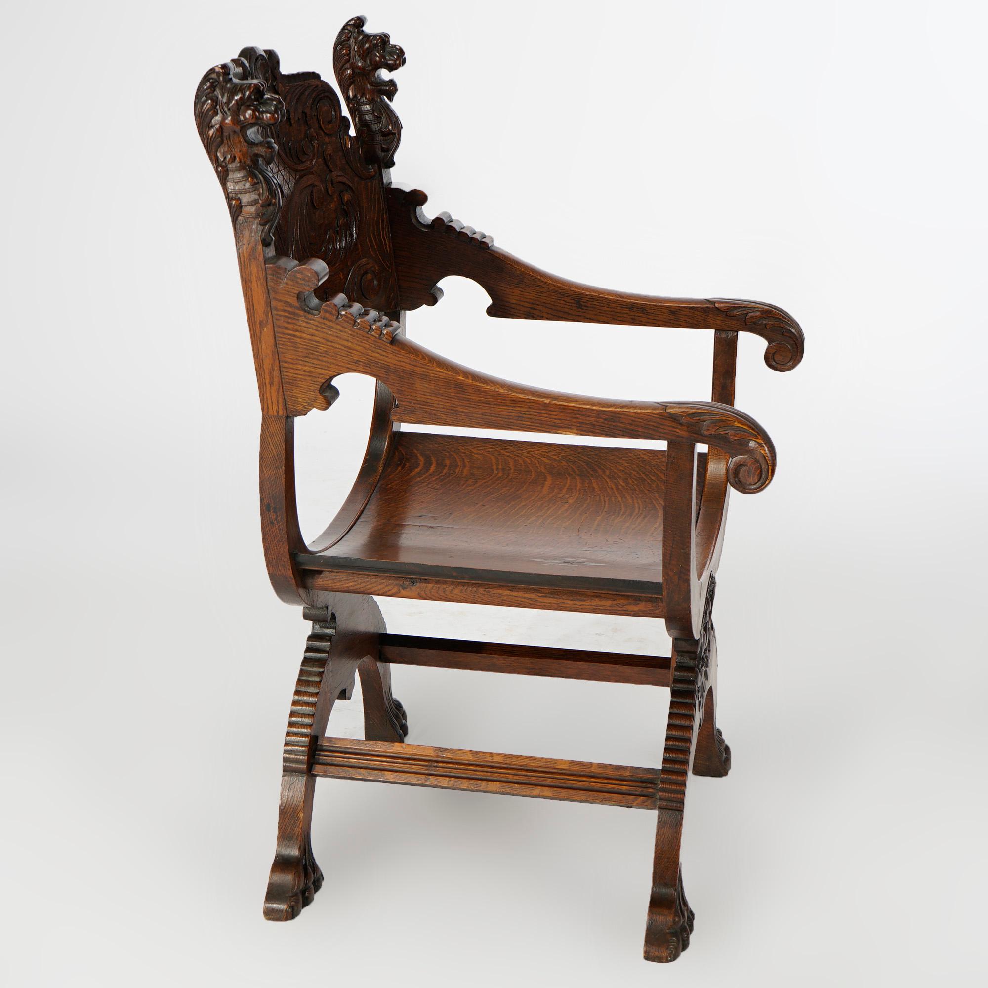 An antique figural director's chair by RJ Horner offers oak construction in curule form with foliate carved back flanked by lion heads, skirt with wind god and raised on convex legs terminating in paw feet, c1900

Measures- 39.5''H x 24.25''W x