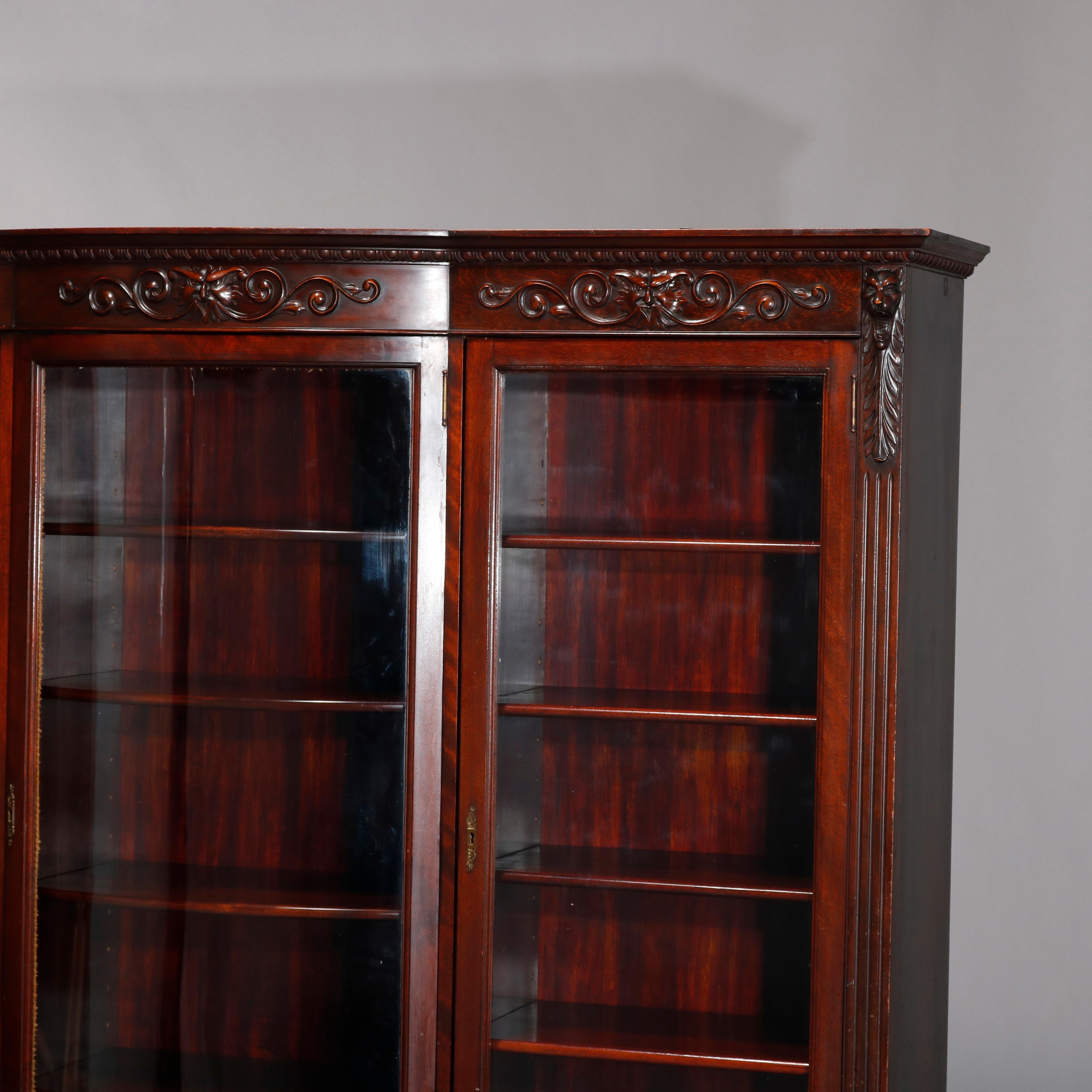 American Antique RJ Horner School Figural Carved Mahogany Bow Front Bookcase, circa 1910