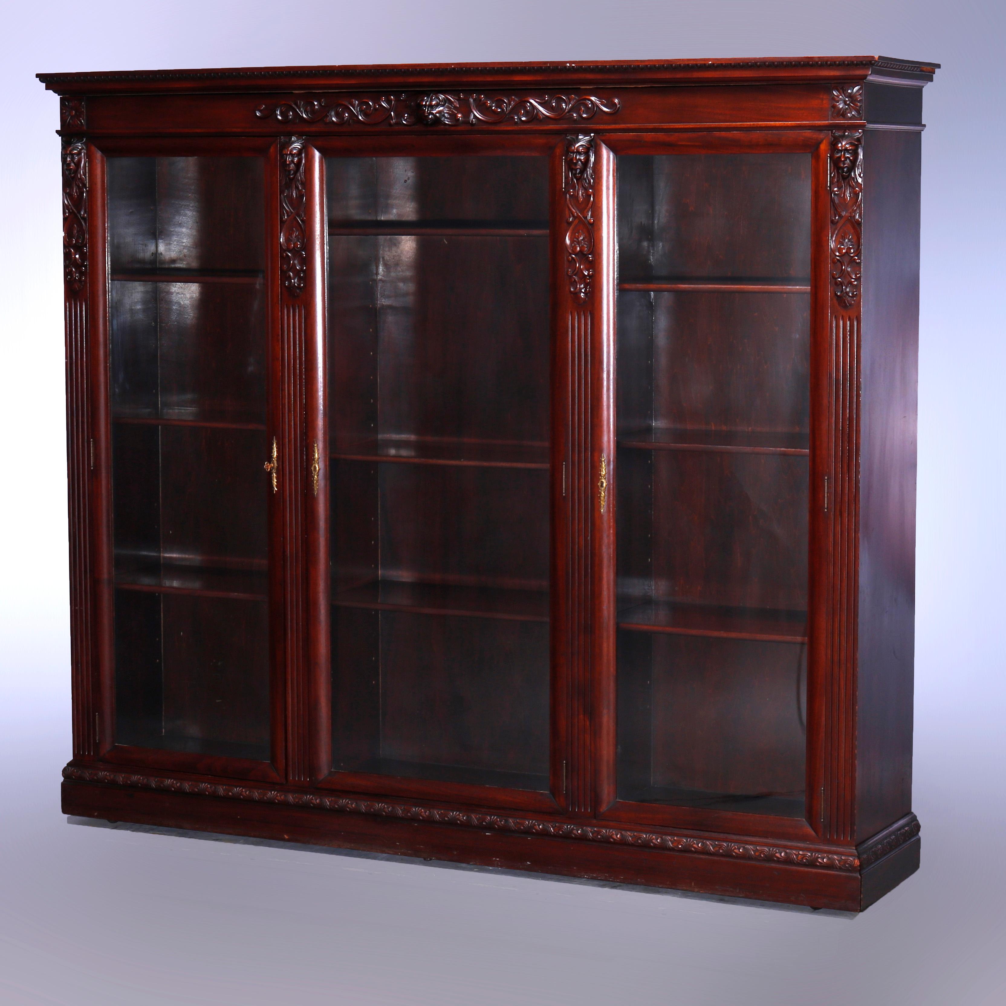 American Antique RJ Horner School Figural Carved Mahogany Triple Door Bookcase, c1890