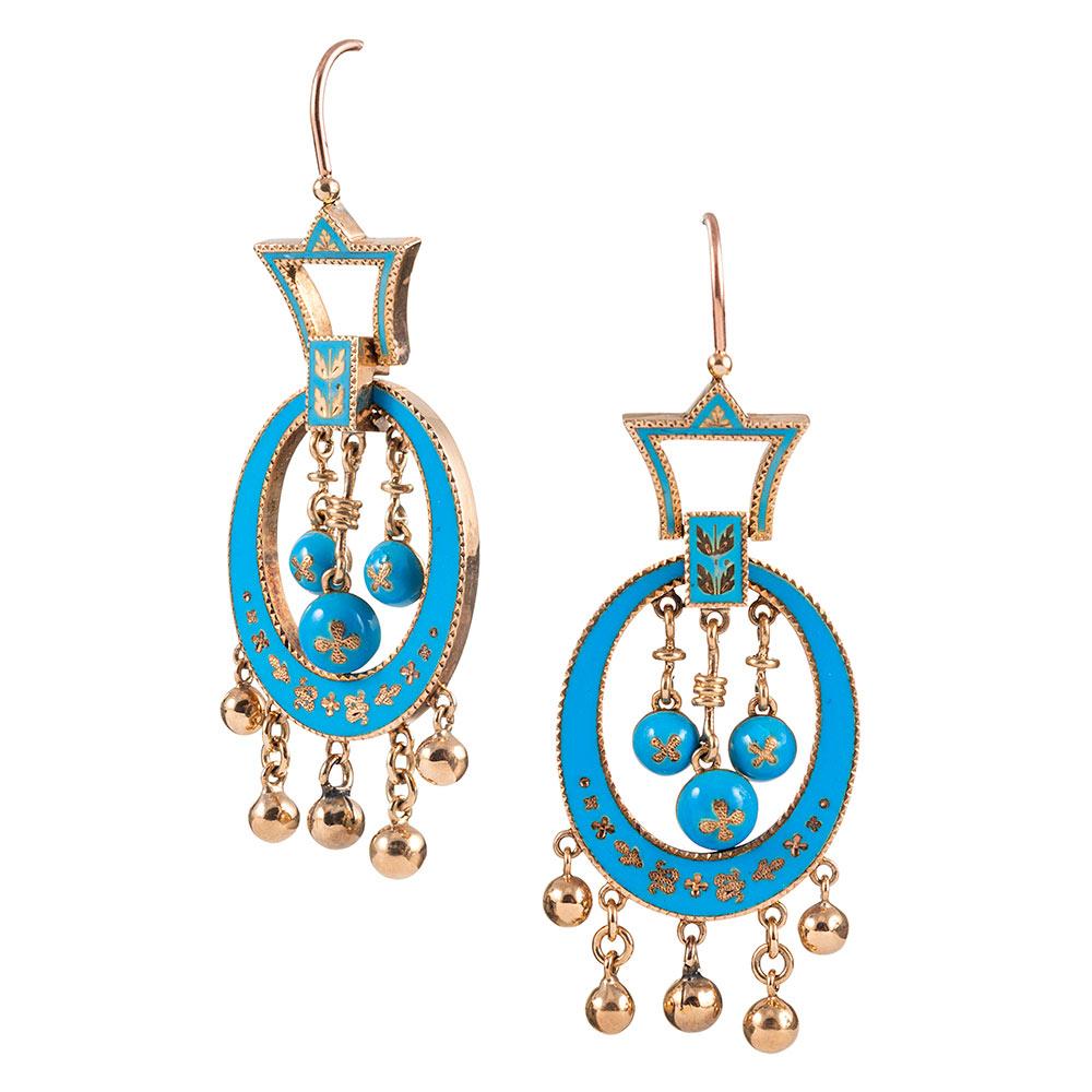 Richly hued enamel in a true robin’s egg blue pops from 14 karat rose gold earrings with fringed orbs of gold suspended from the bottoms. These sculpted earrings are both sophisticated and playful, their fluid movement dancing on the ears. 2.25