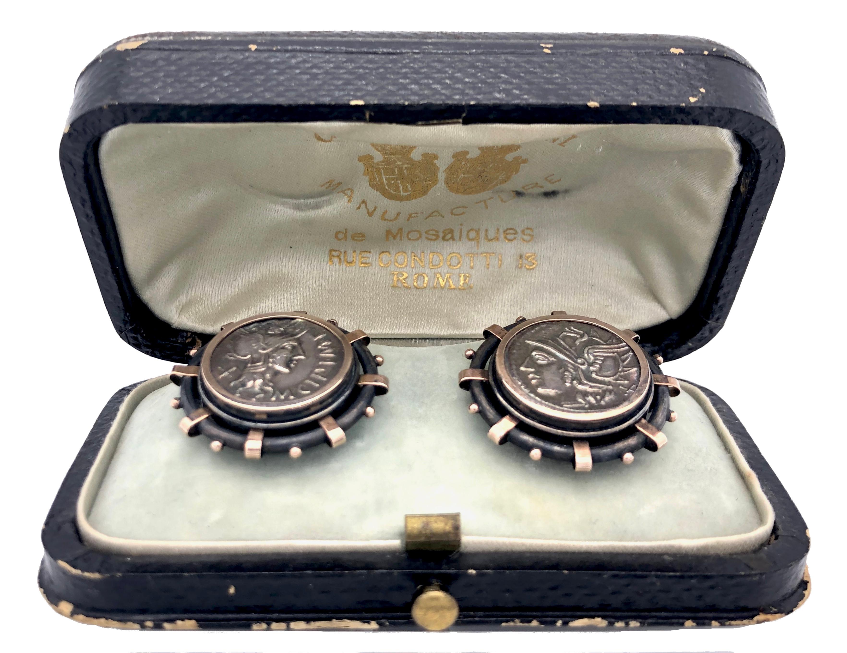 This highly unusual and very rare pair of cufflinks is executed in the archaeological style by the jewellers G.Roccheggiani of Via Condotti 19, Rome.
Antique coins are set in silver mounts, partially blackened and highlighted with rose gold.
A