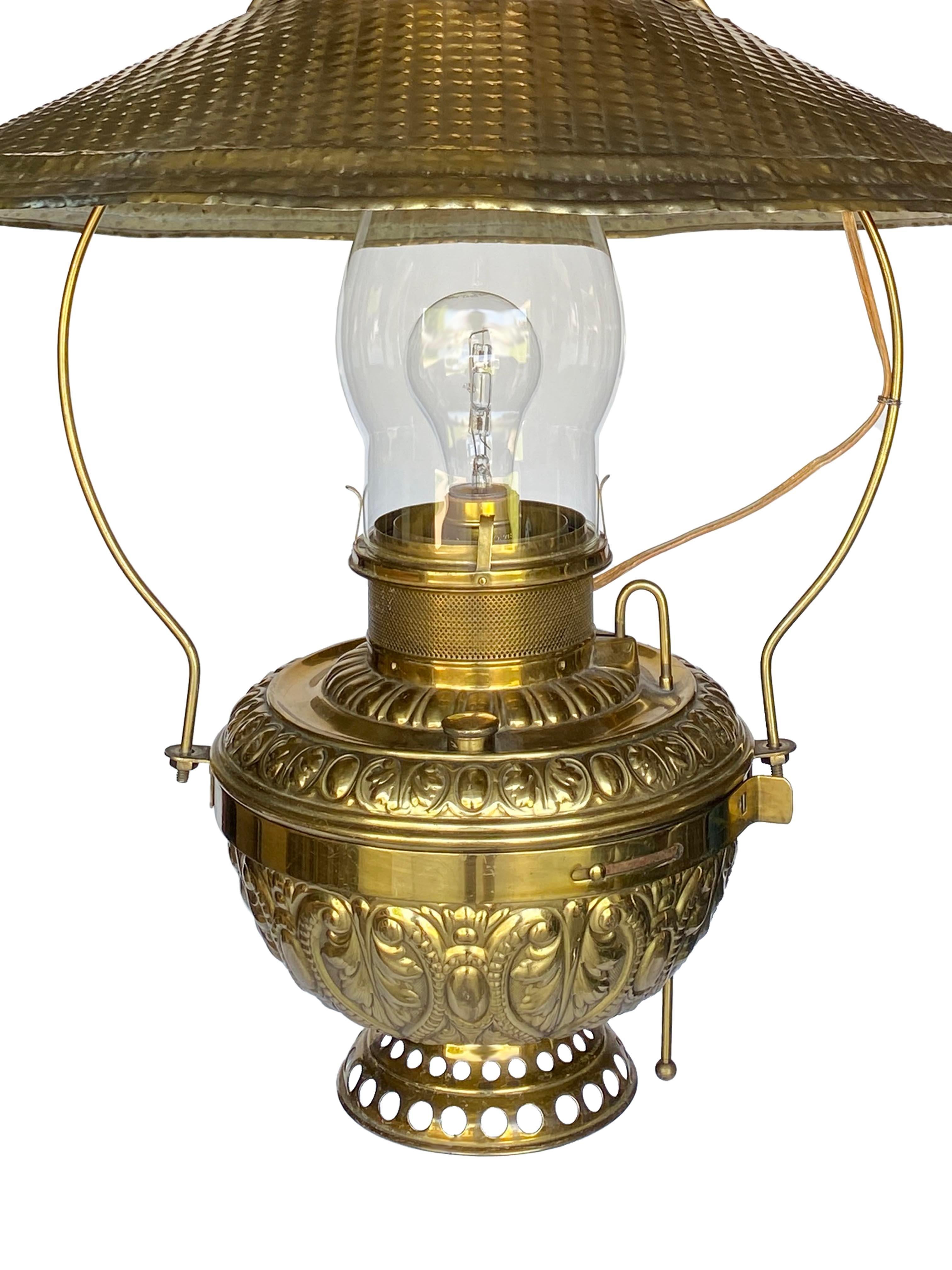This impressive brass ceiling lamp, labeled and named 