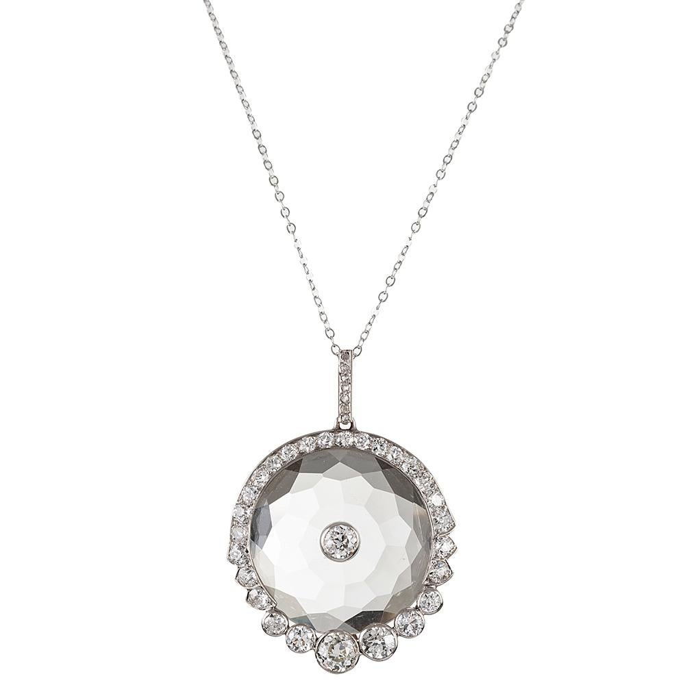 A beautiful creation, made of faceted rock crystal encircled by brilliant white diamonds. The diamonds weigh approximately 3 carats in total. This piece looks beautiful over bare skin or fabric and is ideally-sized for both formal and more casual