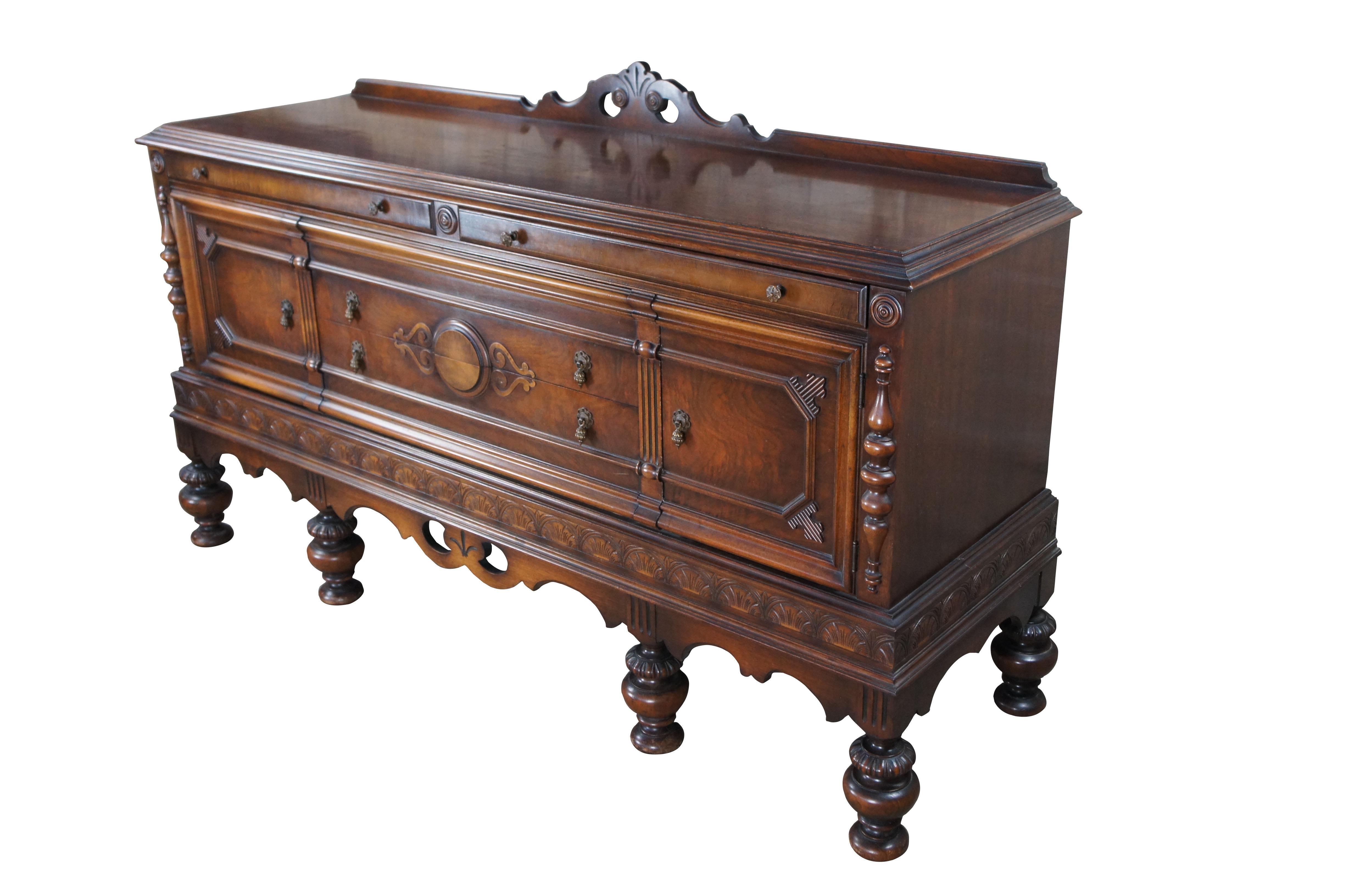 A large and impressive Jacobean / Spanish Revival buffet by Rockford Furniture Company out of Rockford, Illinois, circa 1920. Part of the 