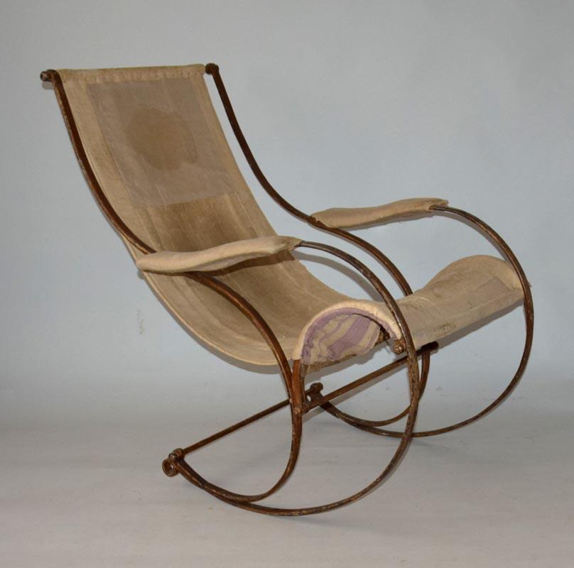 An exceptional range of rocking chair, pioneer of bent chrome and cushioned seating, flat iron straps, round bent construction, hinged upholstery, original backing fabric, padded armrests, original fretwork, PROVENANCE-J. Klauda, pharmacist,