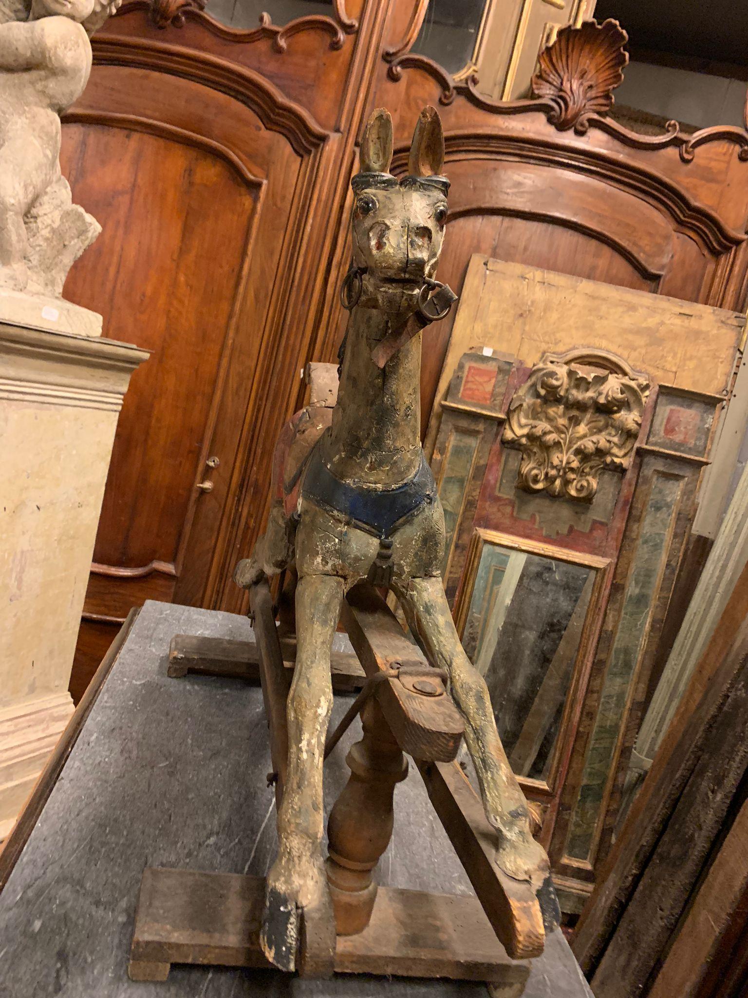 Antique toy horse, hand-carved with underlying bars and rocking movement, hand-built in solid and polychrome wood, provenance from Piedmont (Italy), 18th century, dimensions W 87 x H 74 x D 62 cm