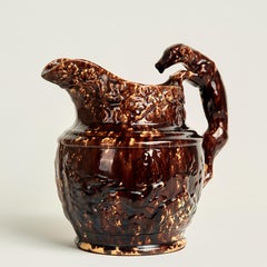 Antique Rockingham Pottery Pitcher with Dog Handle