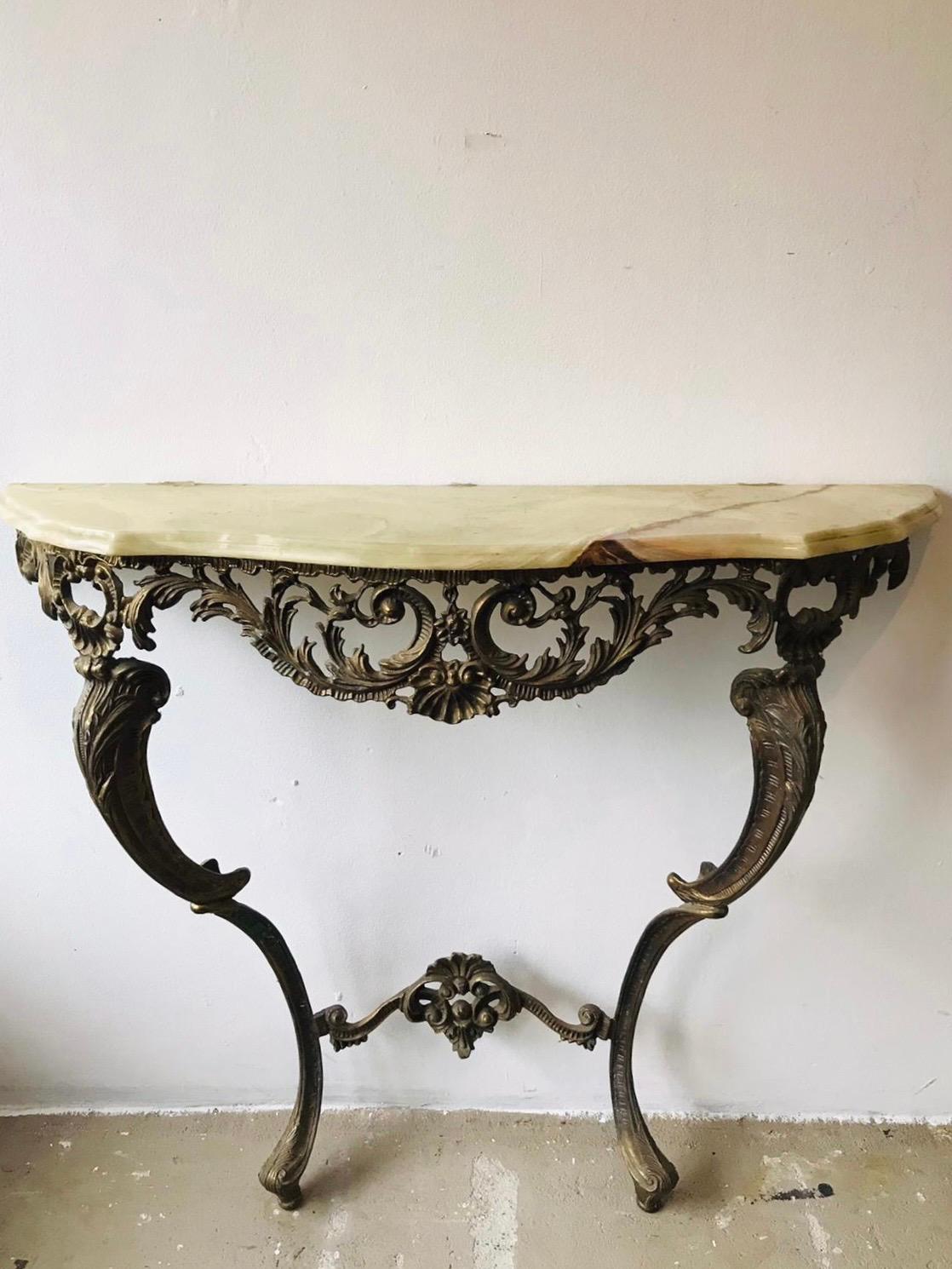 Beautifully shaped classical design piece; wall-mounted with carved cabriole legs with many decorative figures and a nicely veined and cut marble top. Ideal to be placed near your front door to leave your keys on, or anywhere else in the house. More