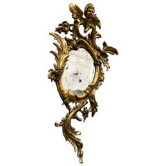 Miroir en bronze figuré rococo ancien