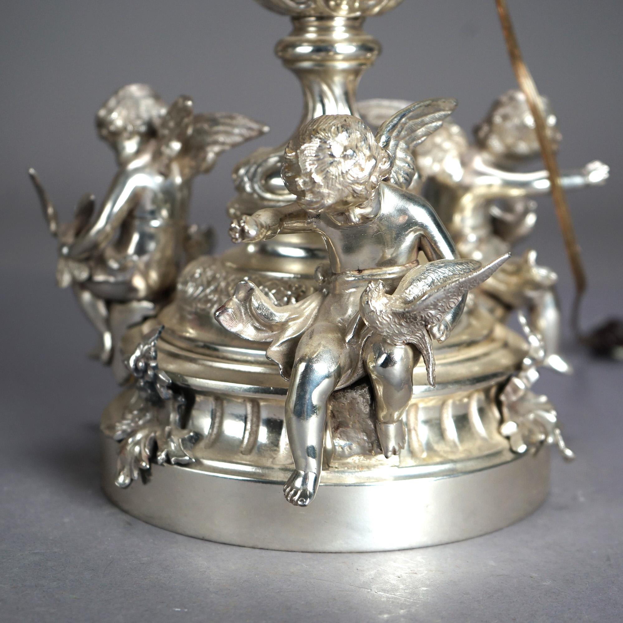 Antique Rococo Figural Silver Plate Parlor Lamp with Winged Cherubs & Angels, Etched Glass Shade, Circa 1890

Measures - 37
