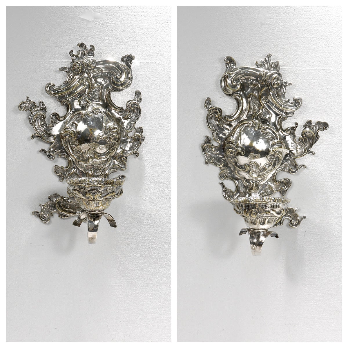 A fine pair of antique silver plated sconces.

From the Rococo Revival period (or quite possibly from the Rococo period itself.) 

Each ornately decorated with rocaille swags and embossed floral decoration.

The candle cups are removable from