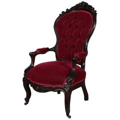 Antique Rococo Revival Carved Walnut and Velvet Button Back Parlor Armchair