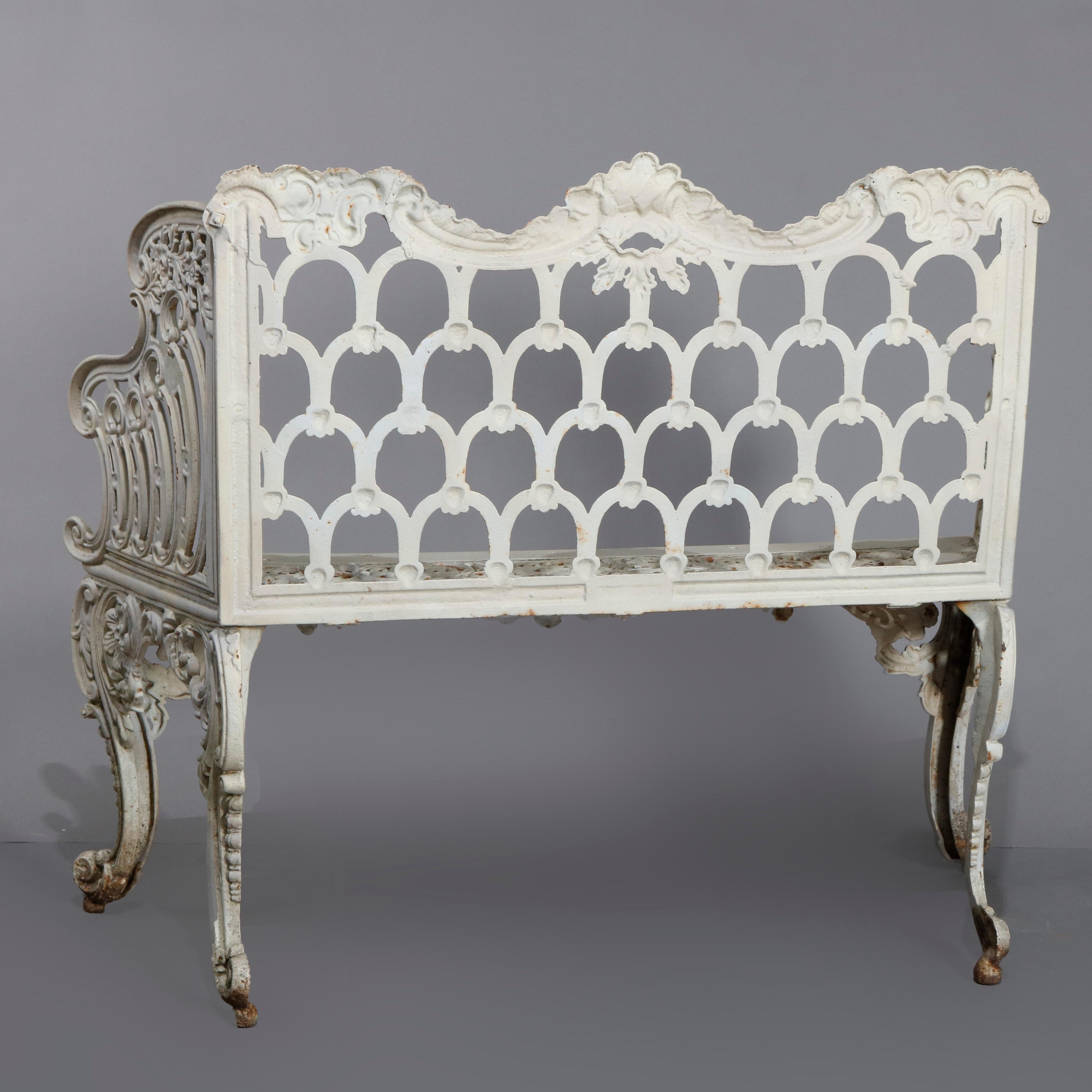 A Rococo Revival white painted and well cast iron 