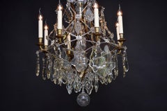 Antique Rococo style brass and crystal chandelier