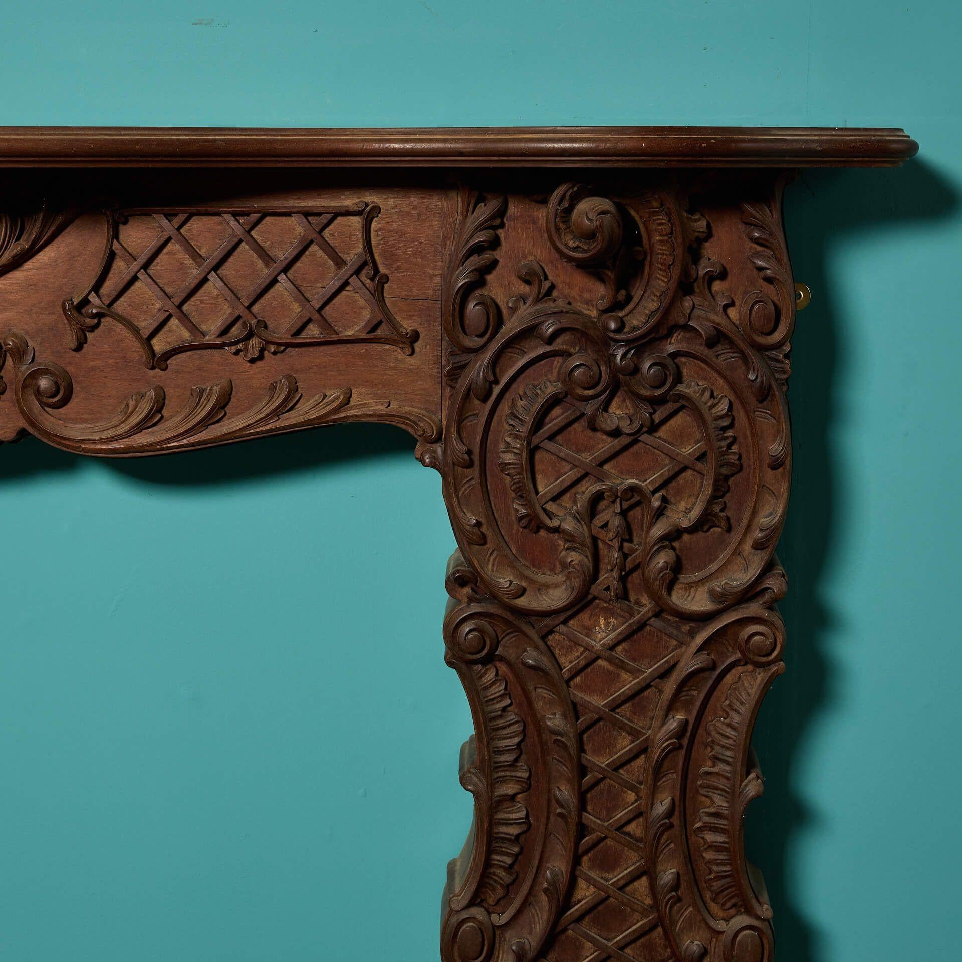 English Antique Rococo Style Carved Mahogany Fire Surround For Sale