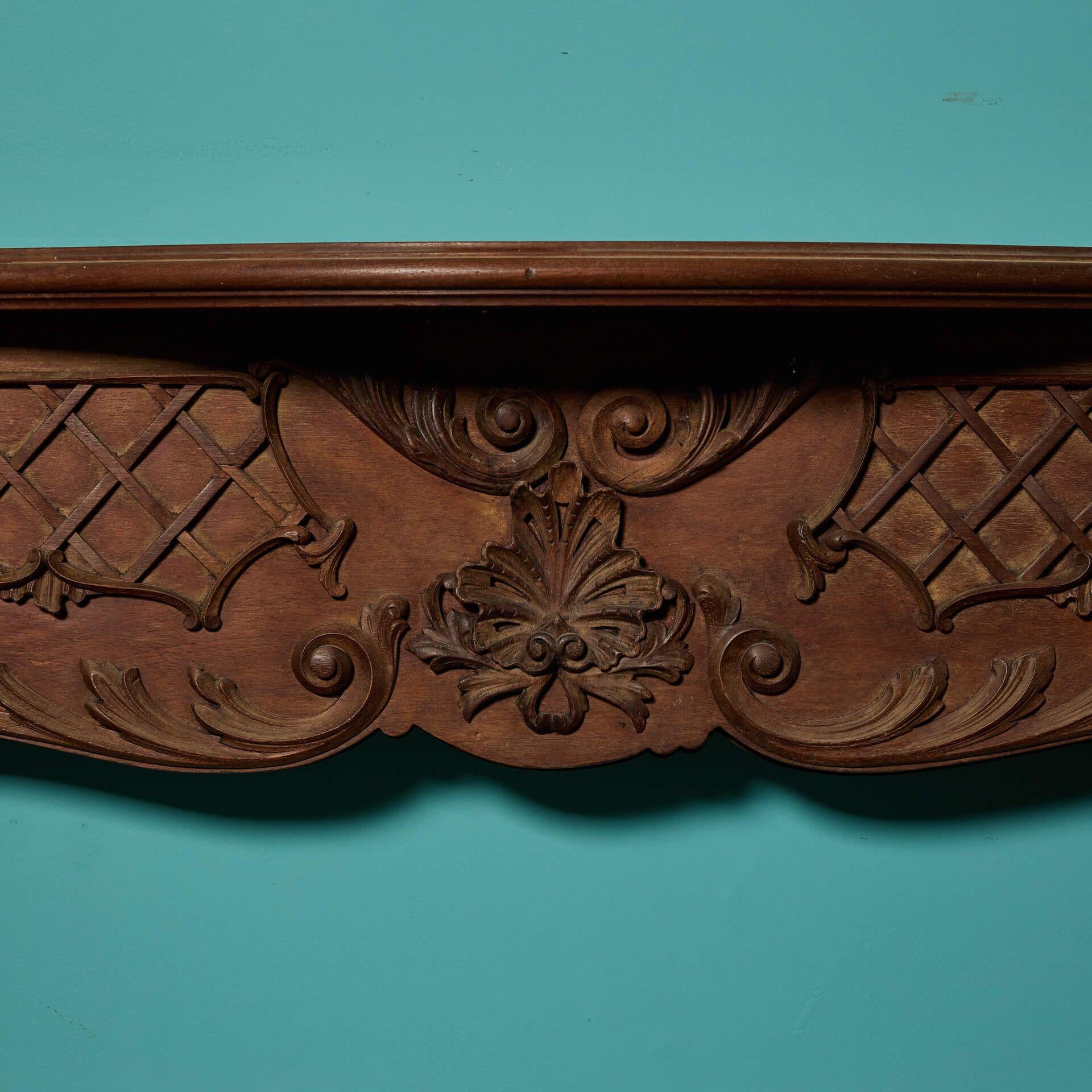Hand-Crafted Antique Rococo Style Carved Mahogany Fire Surround For Sale