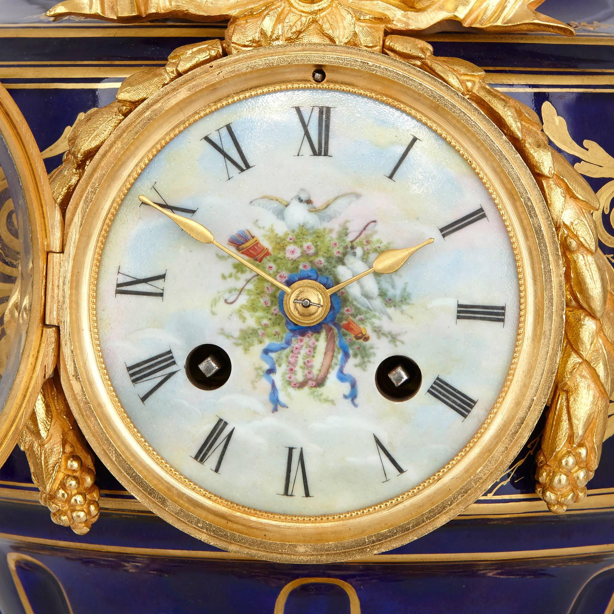 This fantastic clock garniture is a truly exceptional piece of design, which takes after the elegant beauty of the work of the Sevres porcelain Manufactory. Comprising a set of three beautifully decorated vases, the unusual garniture is also mounted