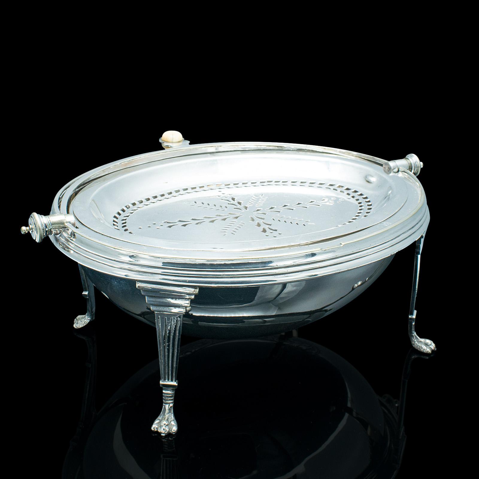 This is an antique roll-over serving dish. An English, silver plated dome top tureen or server, dating to the early 20th century, circa 1920.

Add an elegant touch to the table with this striking tureen
Displays a desirable aged patina and in very