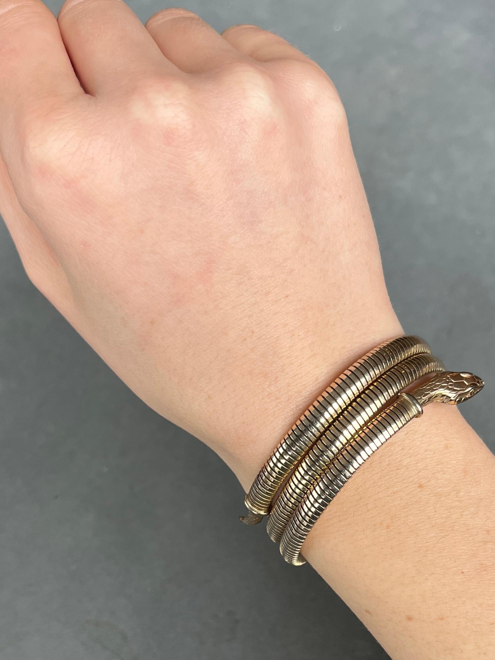 This lovely rolled gold snake bracelet is steel sprung so will fit any wrist. It is rolled gold which means it has a fine layer of gold coating over the bracelet. 

Inner Diameter: 55mm
Bangle Width (in total): 30mm

Weight: 29g