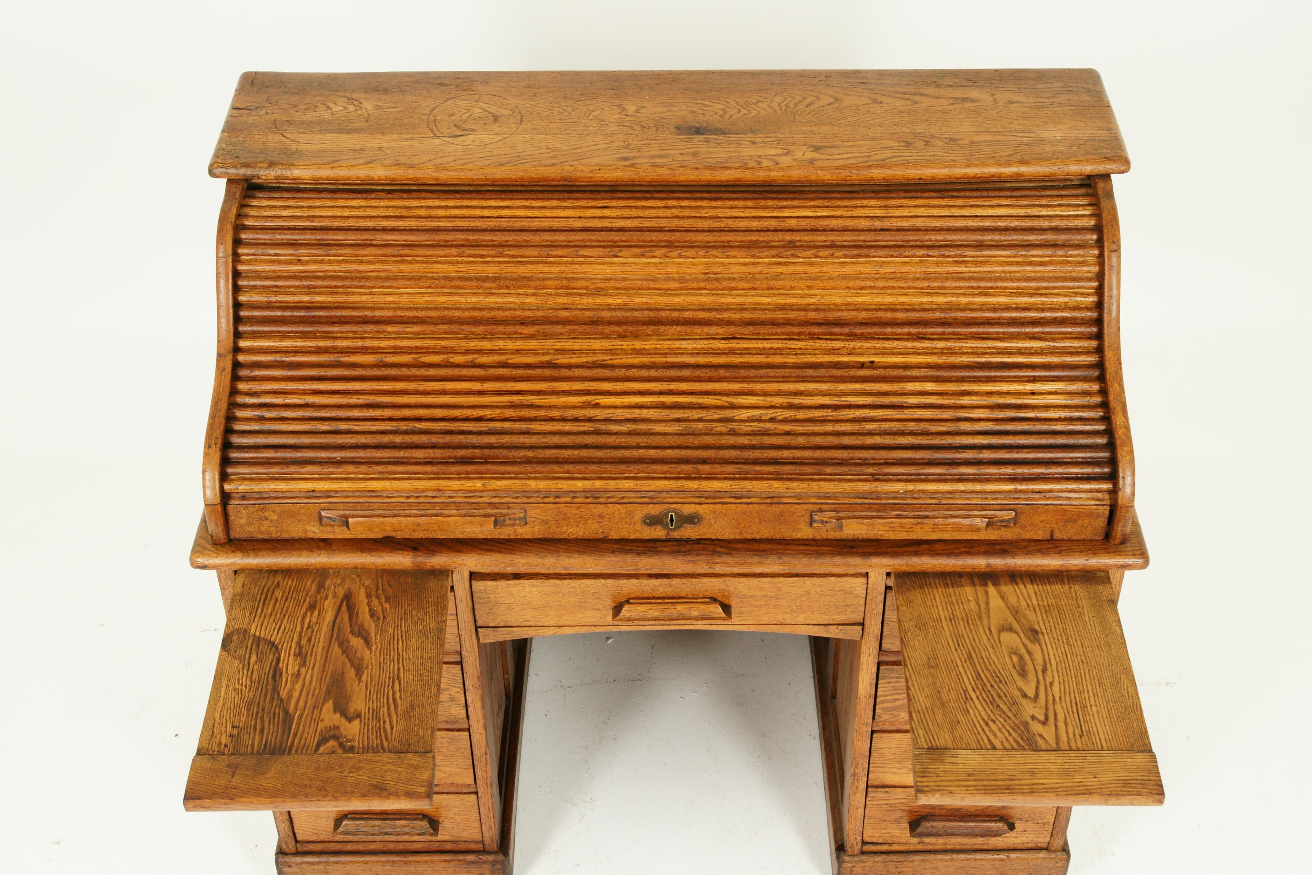 Antique roll top desk, antique desk, oak, Doduble pedestal, Scotland 1910, Antique Furniture

Scotland 1910
Solid oak with original finish
S roll top runs smoothly
Opens to reveal eight pigeon hole, pair of drawers
Letter holders on the