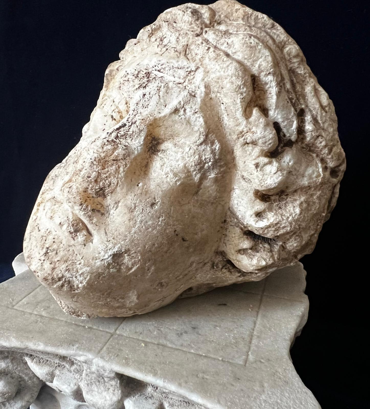 A captivating Roman marble head of Venus, dating from the 1st–3rd century AD, exquisitely carved and presented on a bespoke marble pedestal styled as a classical column top. The delicate features and serene expression epitomize the timeless beauty