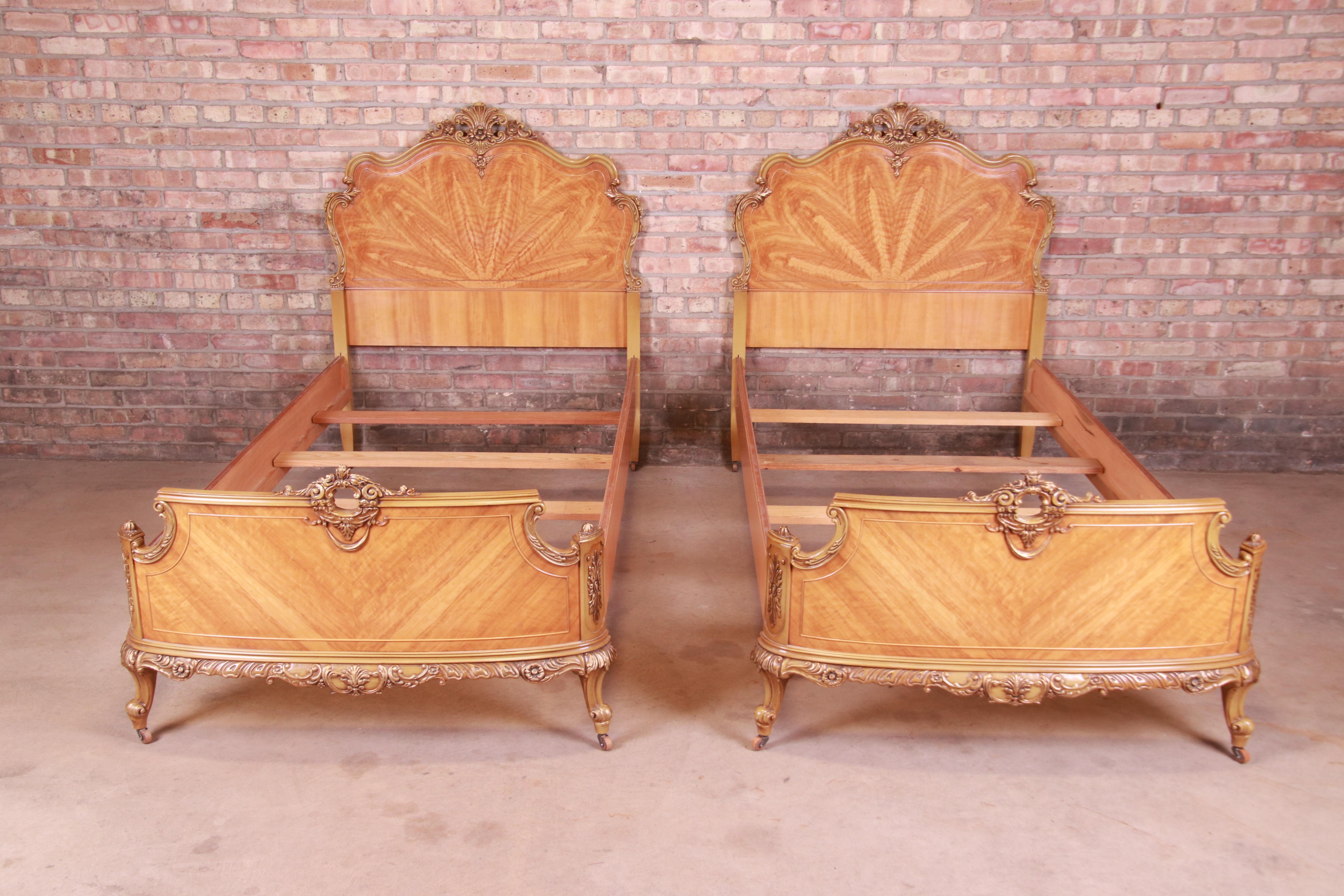 A gorgeous pair of French Rococo Louis XV style twin beds

Attributed to Romweber

USA, Circa 1930s

Inlaid satinwood, with paint and gilt details.

Measures: 43