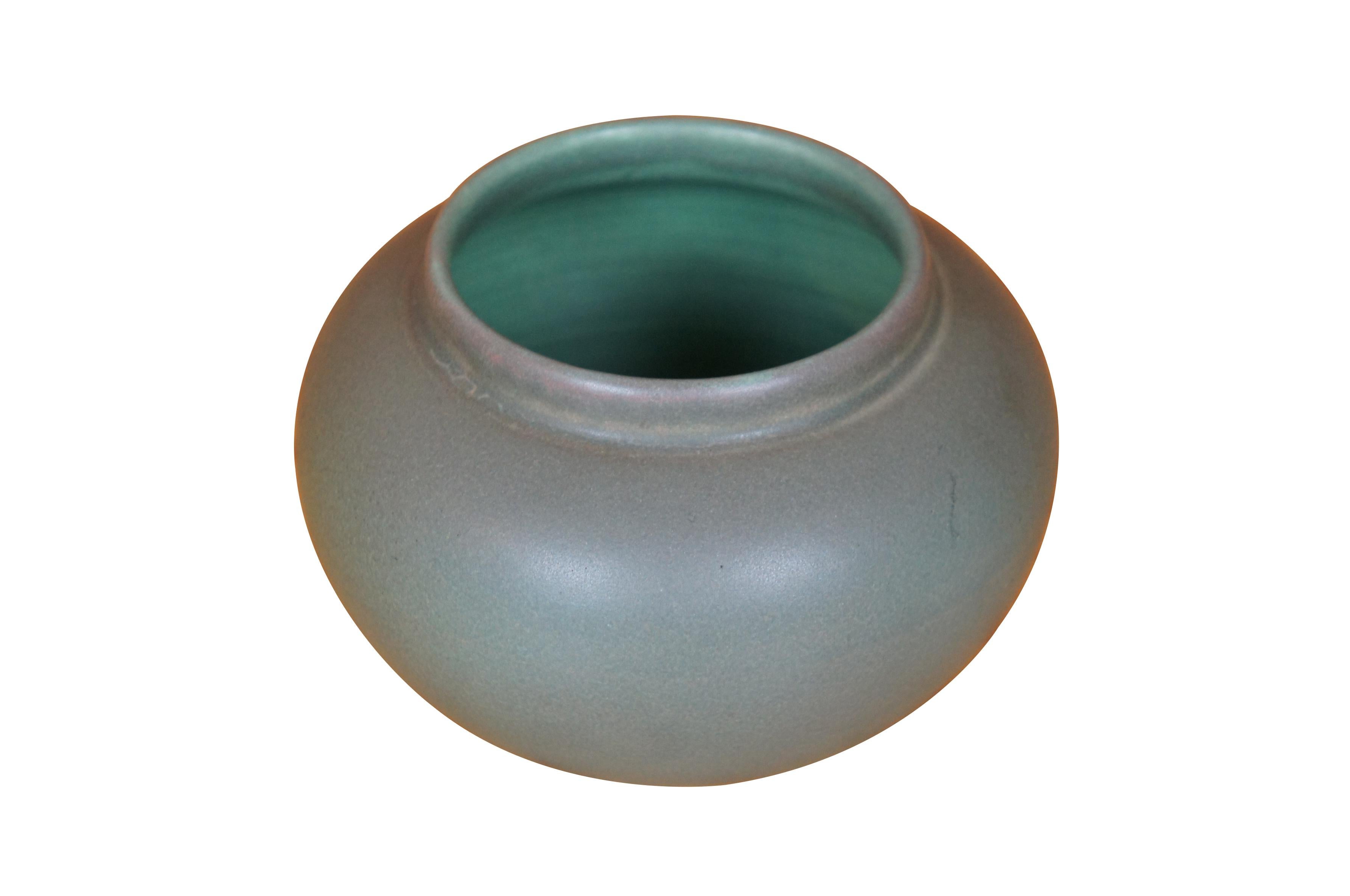 Antique Art Nouveau Rookwood Olga Geneva Reed pot or bowl featuring round form with sea green matte glaze.  Circa 1908.  Shape 622.  Size C.  Signed OGA - Olga Geneve Reed.

Dimensions:
4.5