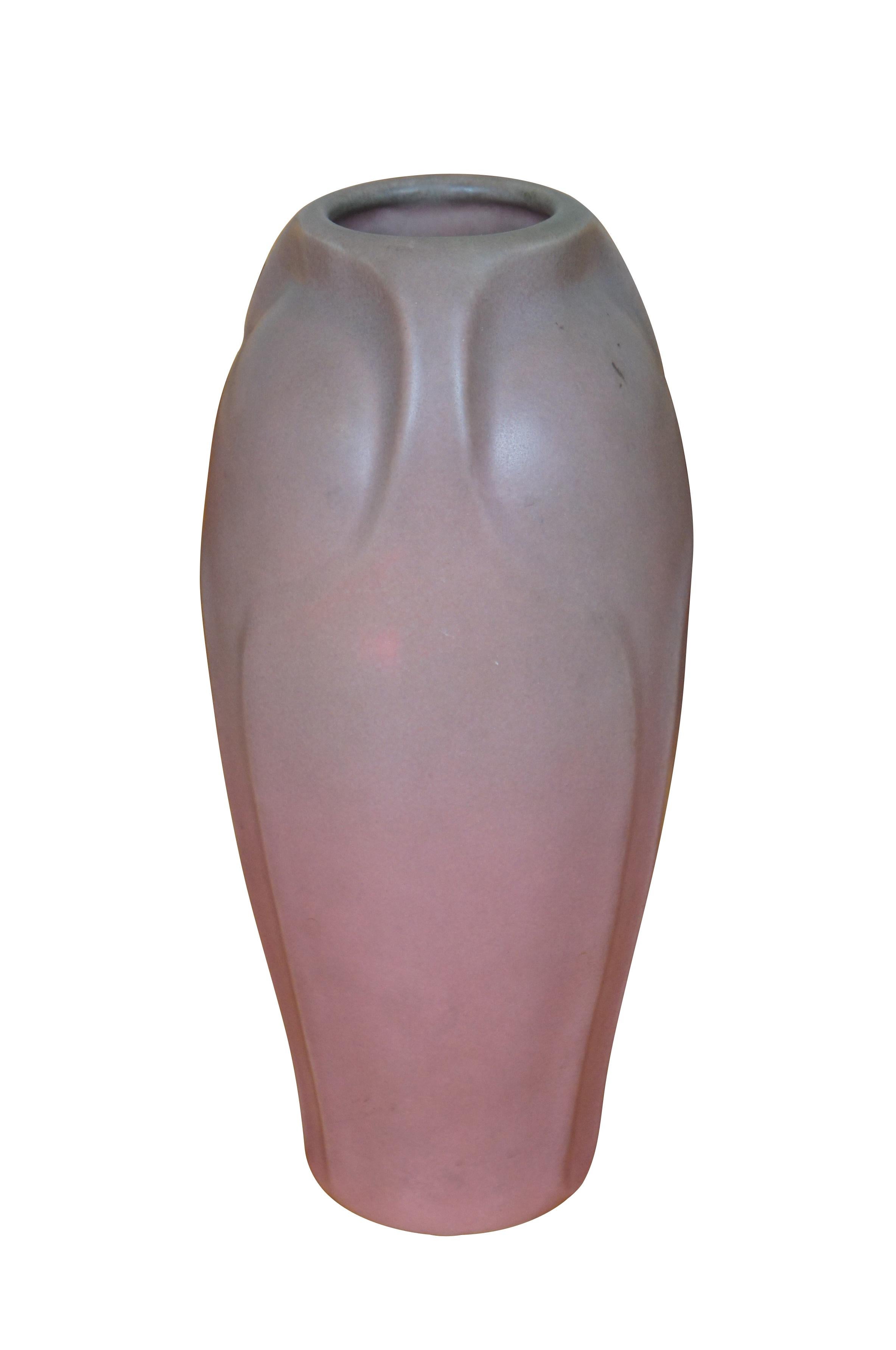 Antique Rookwood Art Deco 1920 XX pink / purple matte glaze vase or urn.  Shape 2404.  This vase was designed by Albert Cyrus Munson, active b.1917.

Albert Cyrus Munson designed pieces at Rookwood Pottery for fifty-four years, between 1890 and