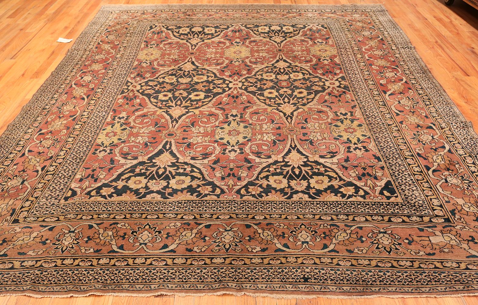 Antique room sized Persian Khorasan carpet, origin country: Persia, circa: 1900. Size: 9 ft 9 in x 12 ft (2.97 m x 3.66 m).  

Exquisite complexity and flawless symmetry define this elegant carpet. Woven by hand in the Khorassan province of eastern