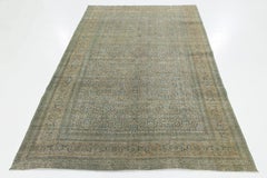 Alfombra persa antigua Tabriz de lana azul con motivos florales por toda la habitación