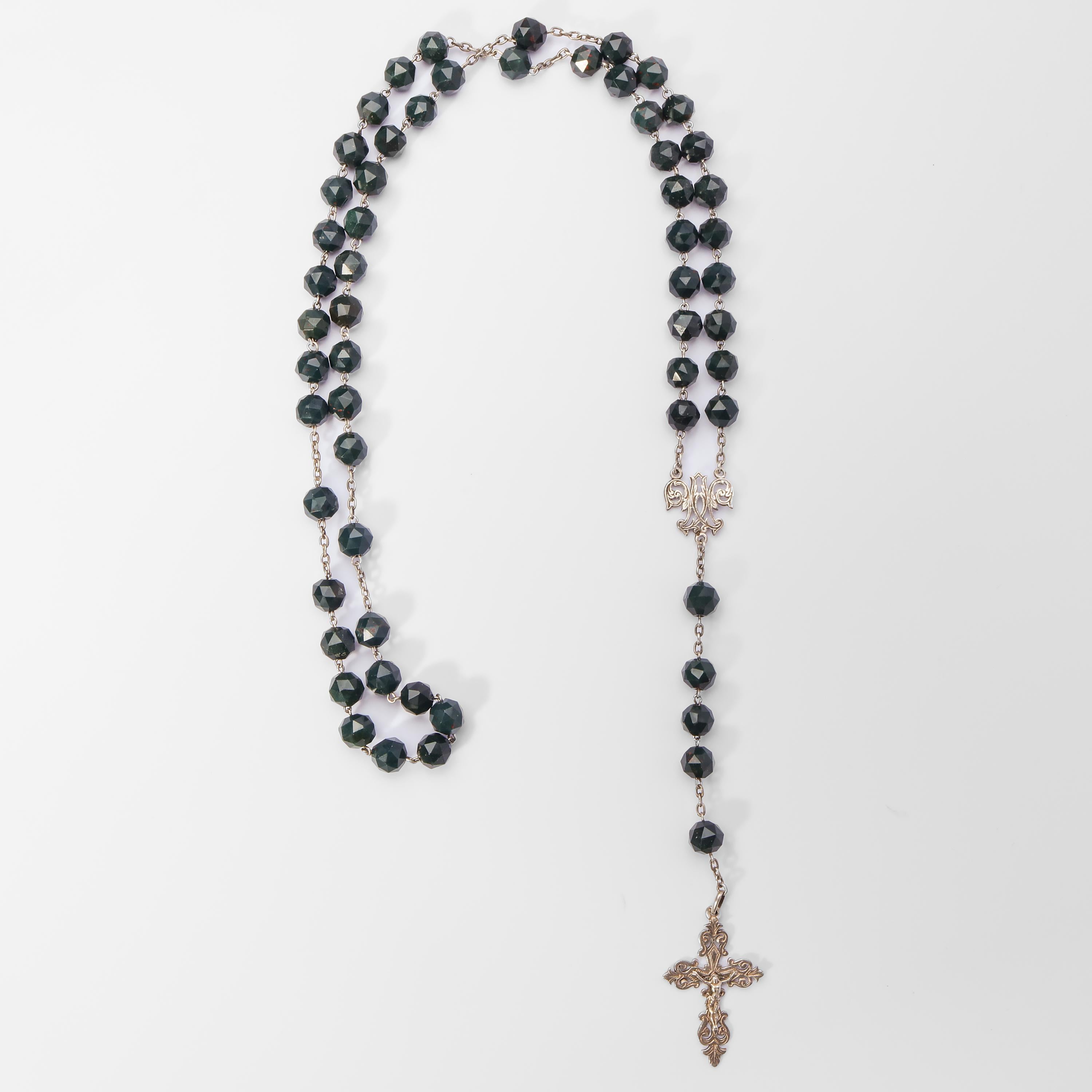 Hailing from the 1880s-1890s is this unusual and beautiful rosary from Europe —France, probably— created from hand-faceted bloodstone beads and silver in cherished (read: excellent) condition. Bloodstone is an especially interesting variety of