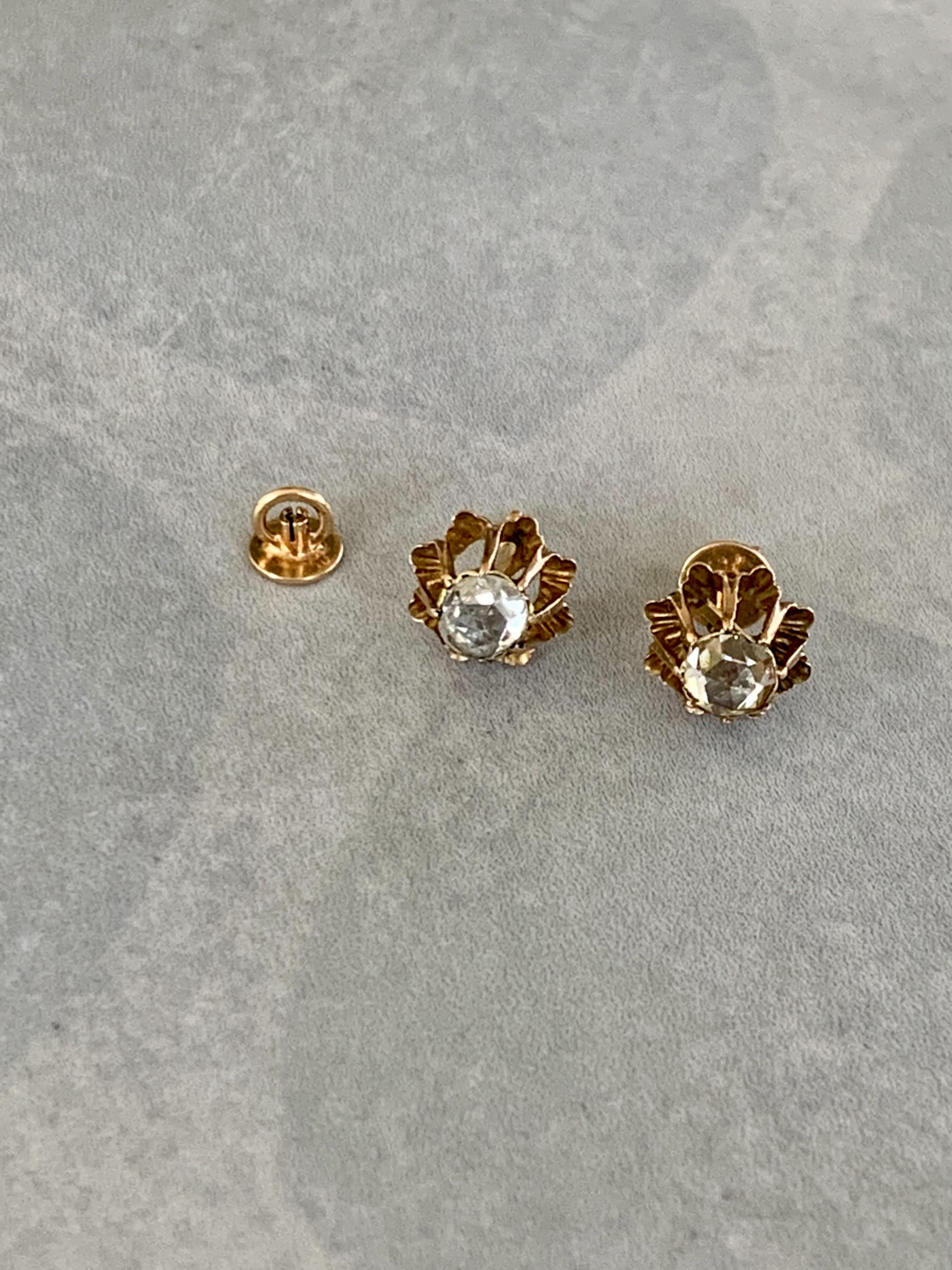 These beautiful earrings feature a 5mm rose cut Diamond.  The total weight of both Diamonds is .65ctw.

Cut/Clarity H-J/ SI
Weight: 2.4 grams

These earrings are in very good condition. 