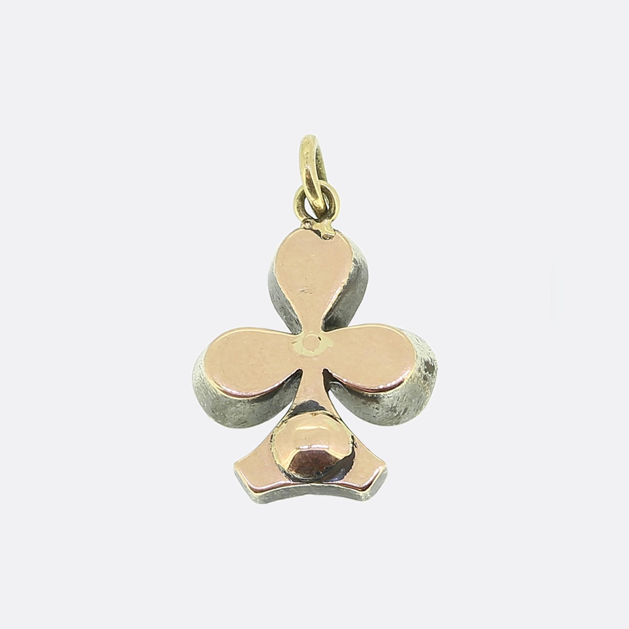 Here we have a charming little pendant dating back to the Georgian period. Meticulously crafted from a blend of gold and silver, this antique piece is designed in the shape of a clover, featuring three pear shaped rose-cut diamonds and single round