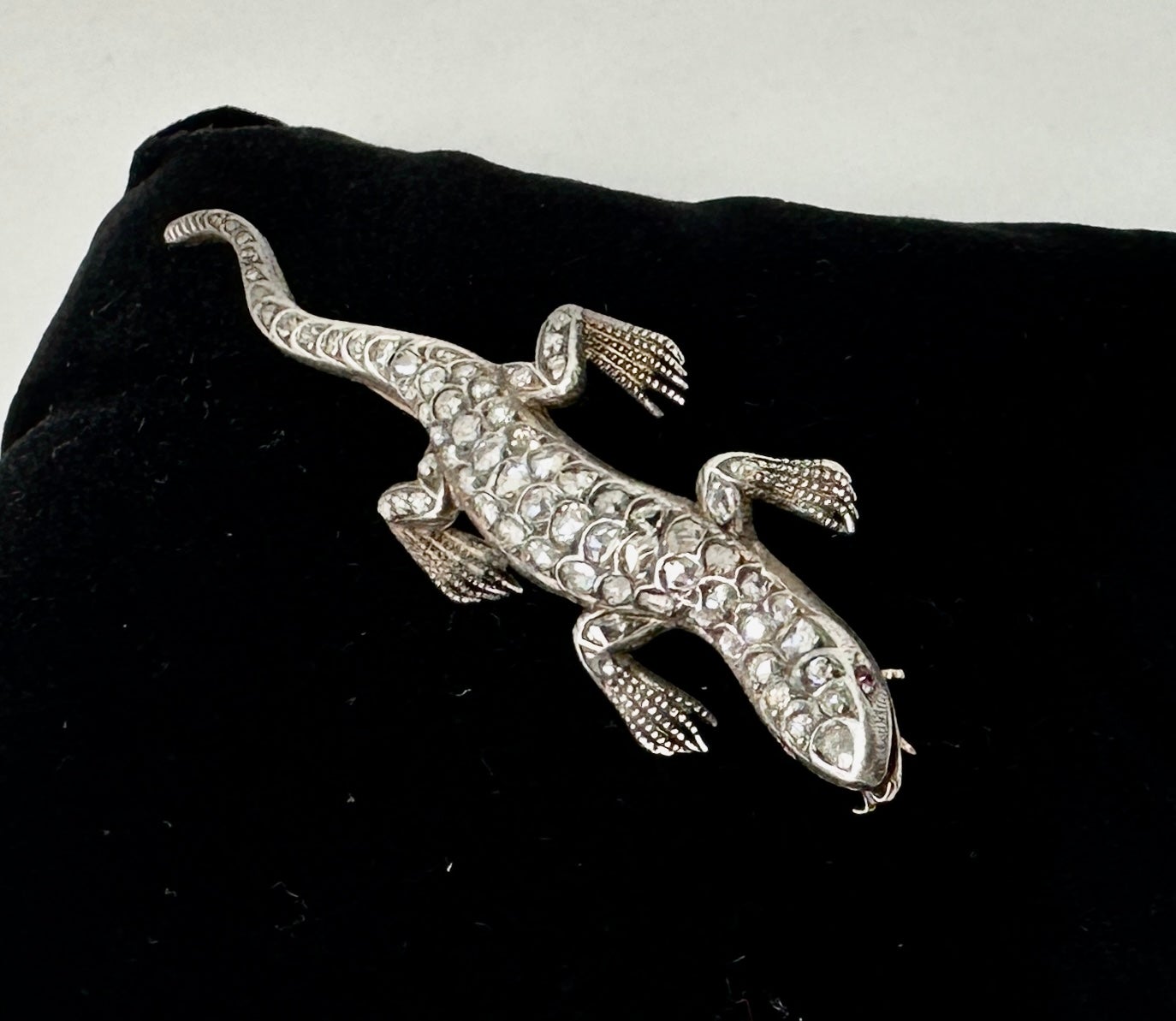 This is a wonderful antique Victorian - Belle Epoque Lizard, Salamander, Chameleon Brooch Pin set throughout with Rose Cut Diamonds in a gorgeous three dimensional design in Silver atop 14 Karat White Gold.  This is one of the most beautiful antique