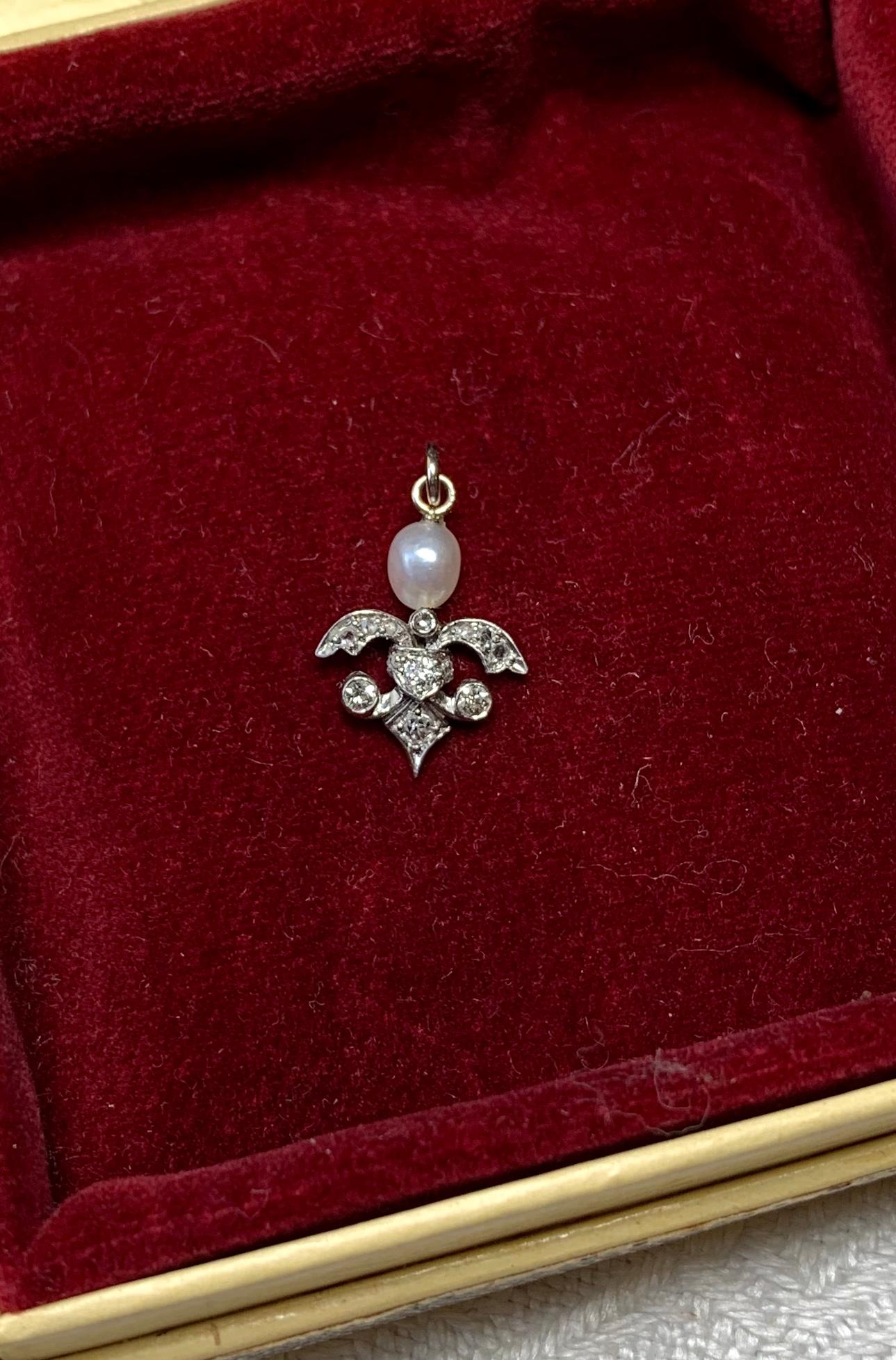 A wonderful original Art Deco - Victorian - Belle Epoque pendant with a stunning White Pearl above an extraordinary design set with Rose Cut and Old Mine Cut Diamonds in 14 Karat White Gold.  The pendant dates to circa 1860-1920.  The design of this