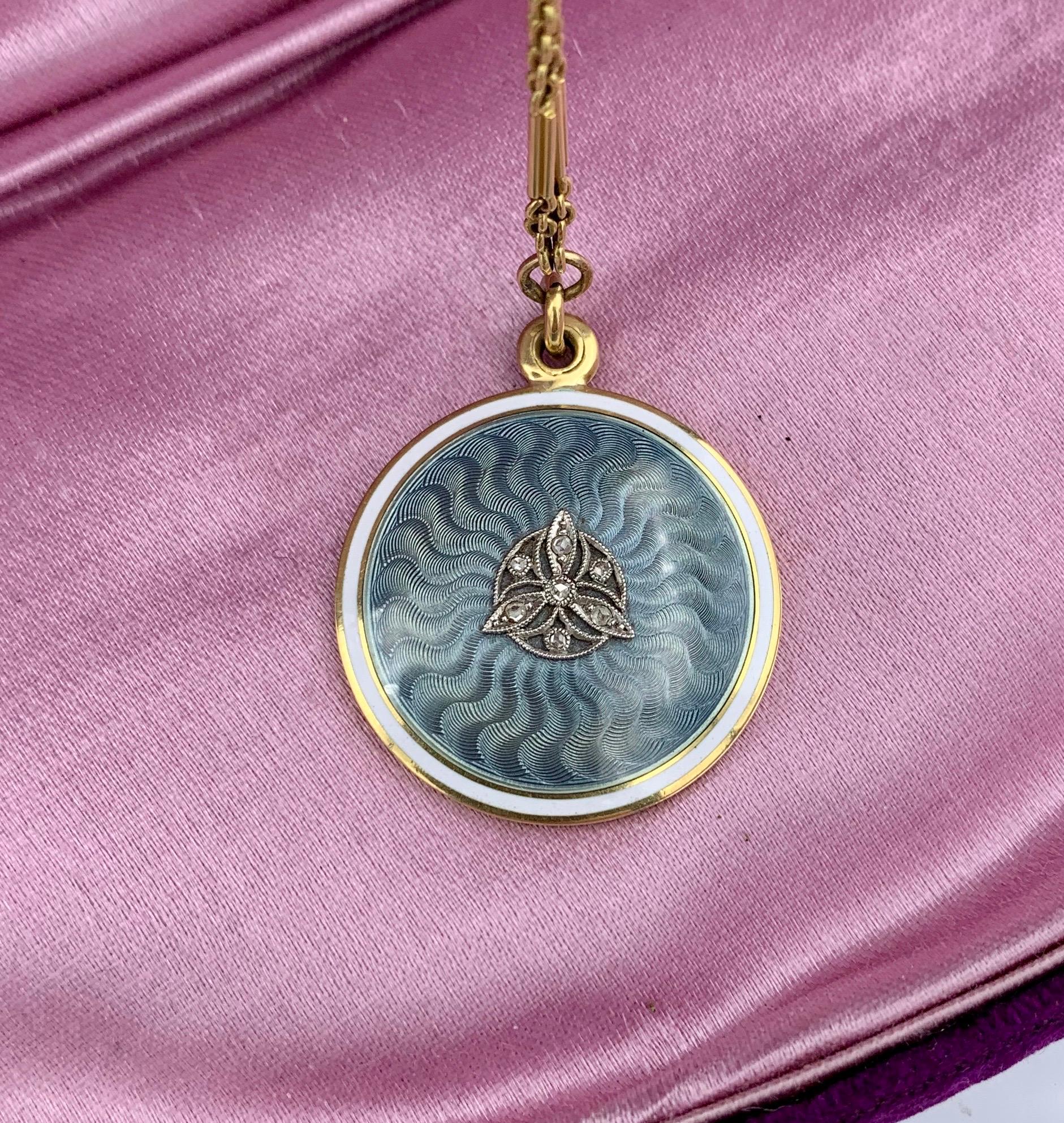 This is a Museum Quality Antique Edwardian Locket Necklace from the estate of Ambassador Evan Galbraith.  The magnificent locket (one of two matching lockets from the estate) has exquisite robin's egg blue guilloche enamel with a white enamel target