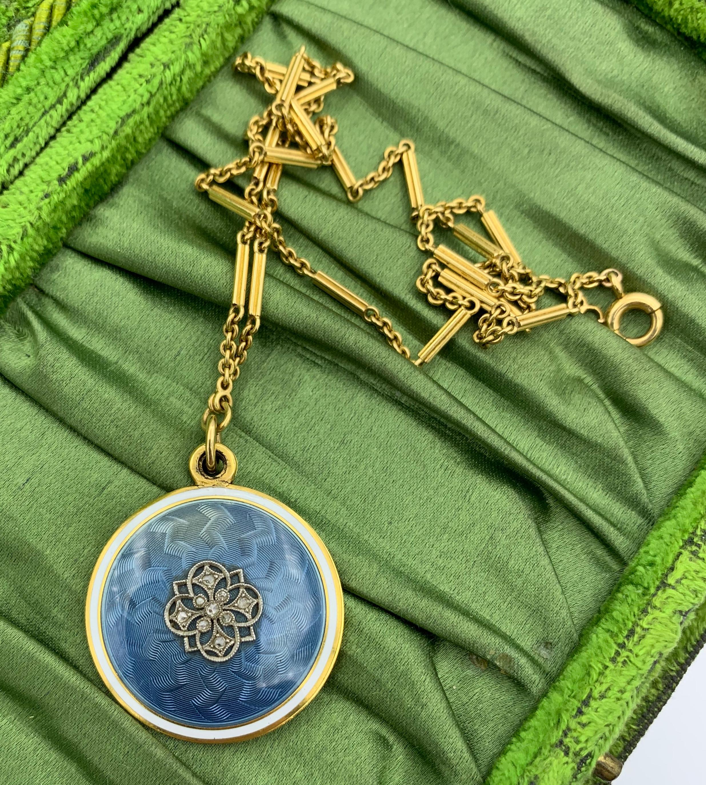 This is a Museum Quality Antique Edwardian Locket Necklace from the estate of Ambassador Evan Galbraith.  The magnificent locket (one of two matching lockets from the estate) has exquisite robin's egg blue guilloche enamel with a white enamel target