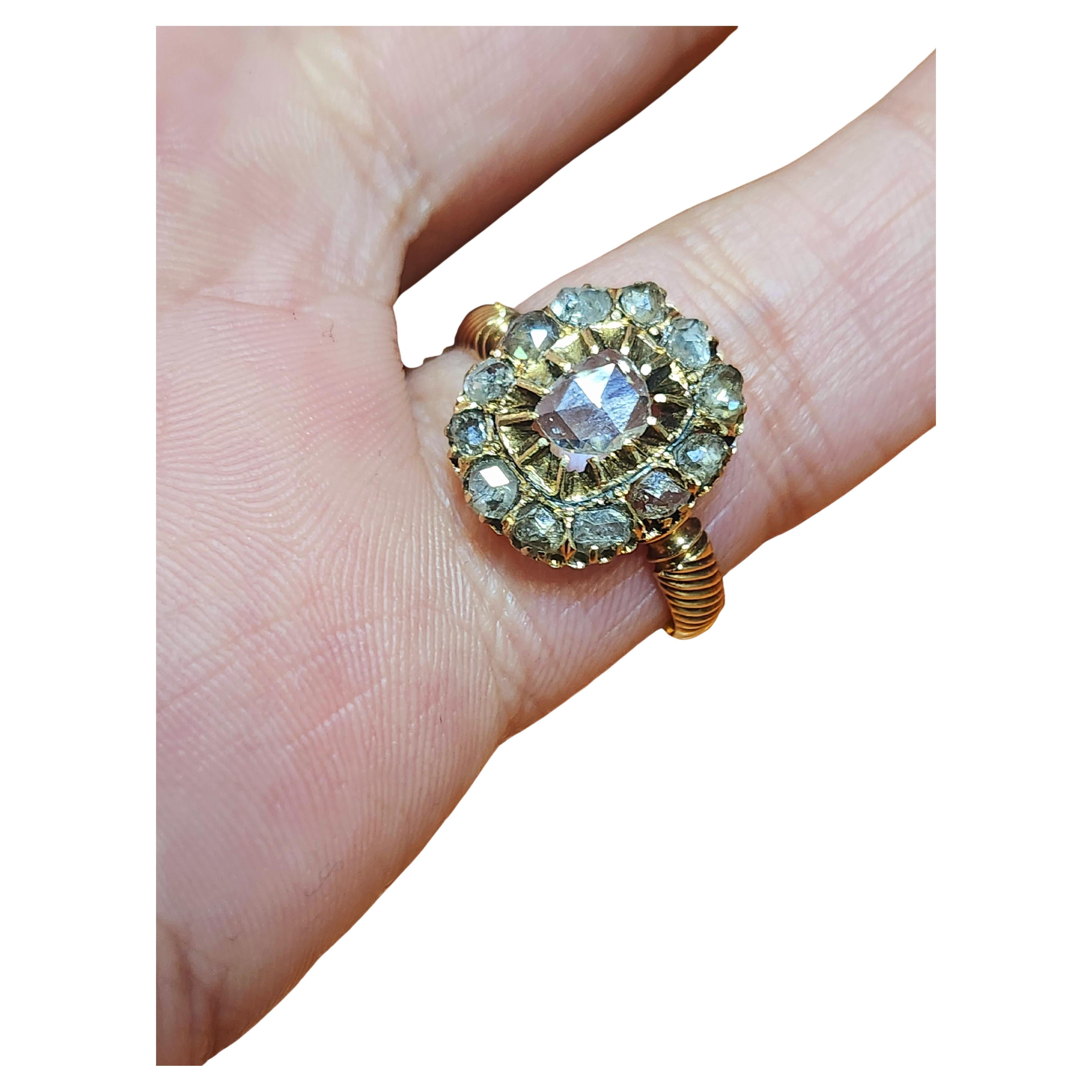 Antique Russian rose cut diamond 14k gold ring centered with single cut rose diamond flanked with several small rose cut diamonds with an estimate diamond weight of 1.5 carats with detailed work on ring band sides hall marked 56 imperial Russian