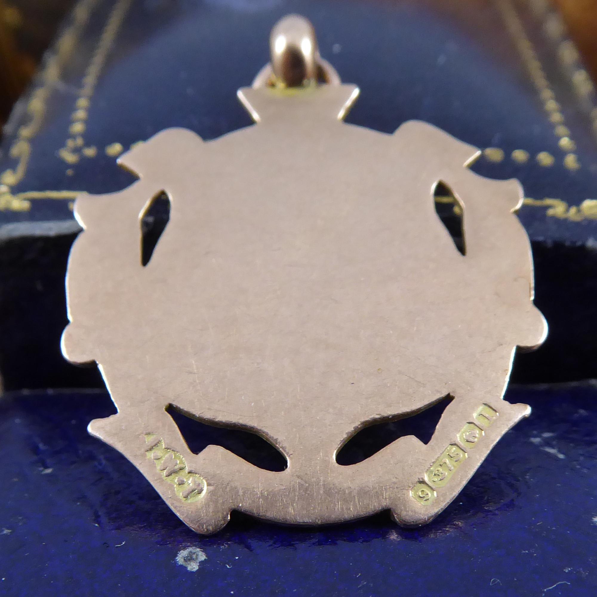 An antique Albert shield suitable for wearing with a pocket watch or added to chain and worn as a pendant.  The Albert has been crafted in 9ct rose gold and features a shield monogrammed with the intitials AW.  The shield has been applied to a