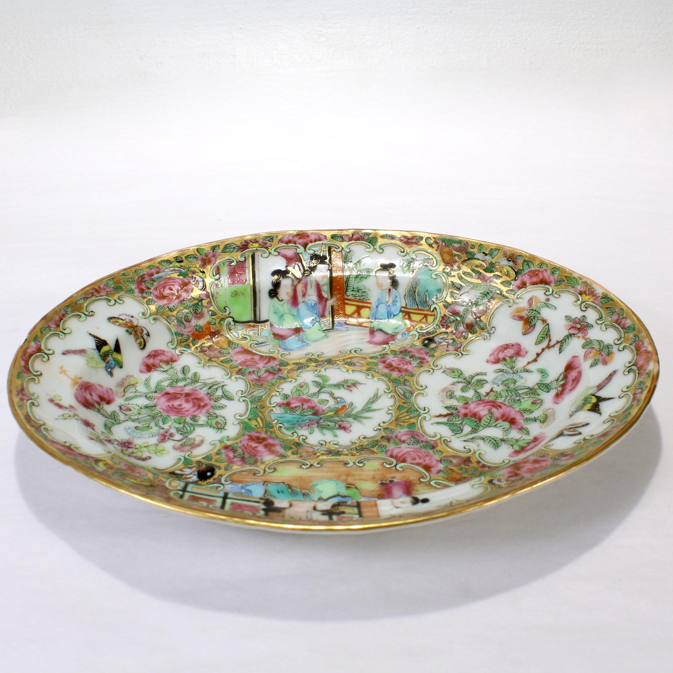 A fine antique Chinese Export porcelain small tray.

In the Rose Medallion (Famille Rose) style.

The central cartouche of the bowl depicts birds & foliage. The four external cartouches are set up as two pairs of court scenes and two birds & foliage