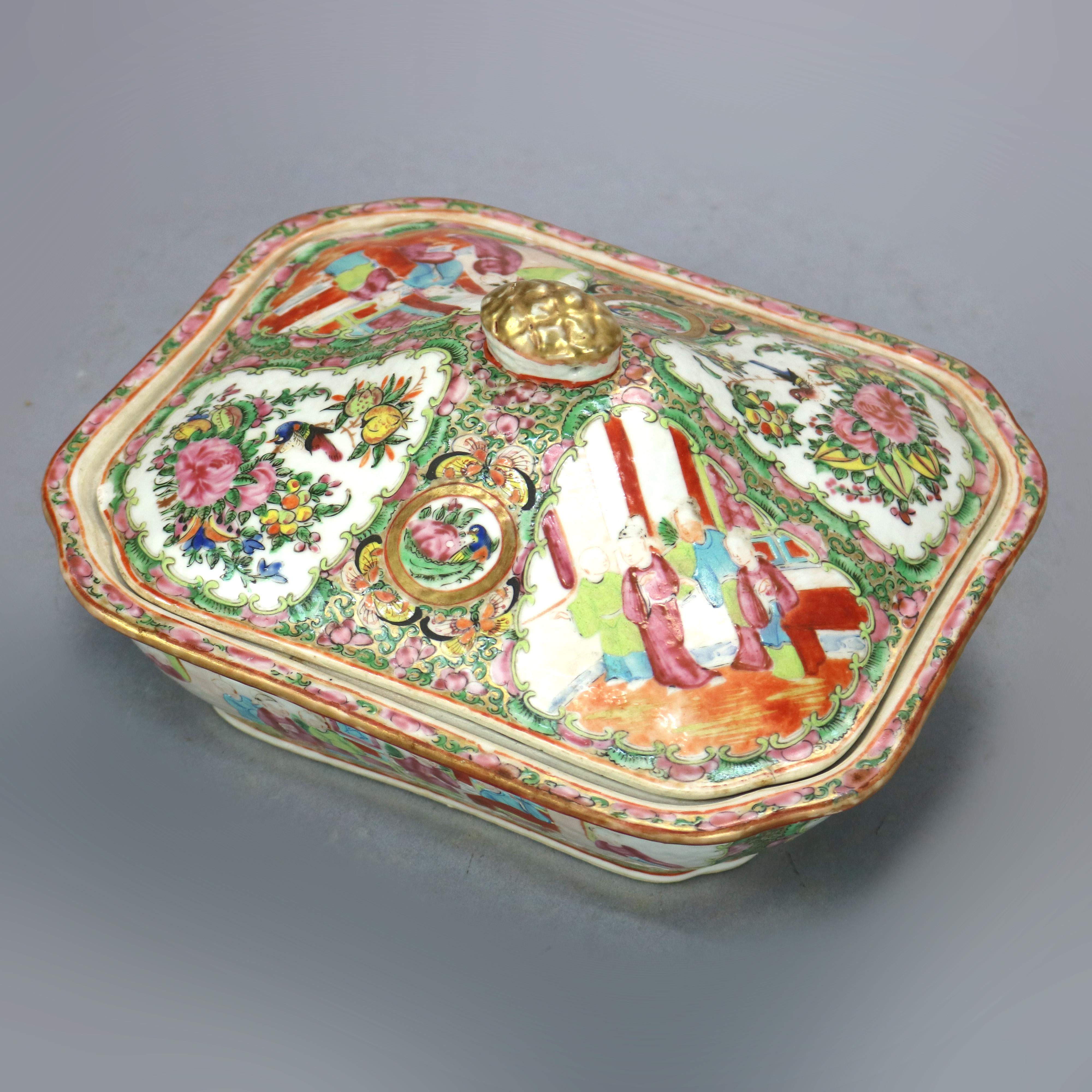 An antique Chinese rose medallion lidded tureen offers ceramic construction having exterior with hand enameled reserves with garden and genre scenes, interior allover floral decorated, 19th century.

Measures: 5.25
